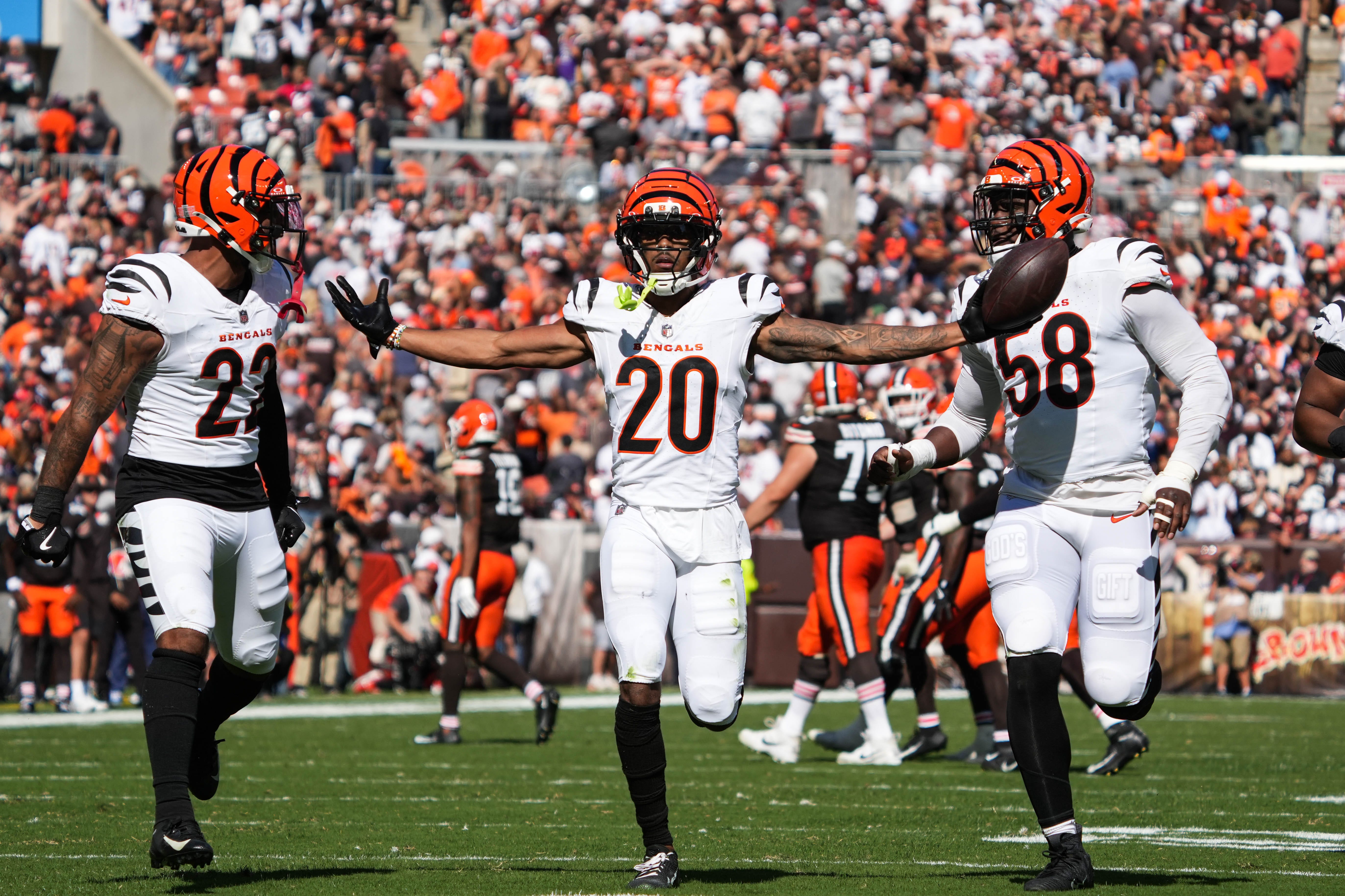 Bengals DJ Turner II (20) celebrates with his team after catching an interception during their game against the Cleveland Browns at Huntington Bank Field on Sunday September 7, 2025. The Bengals won the game with a final score of 17-16.
