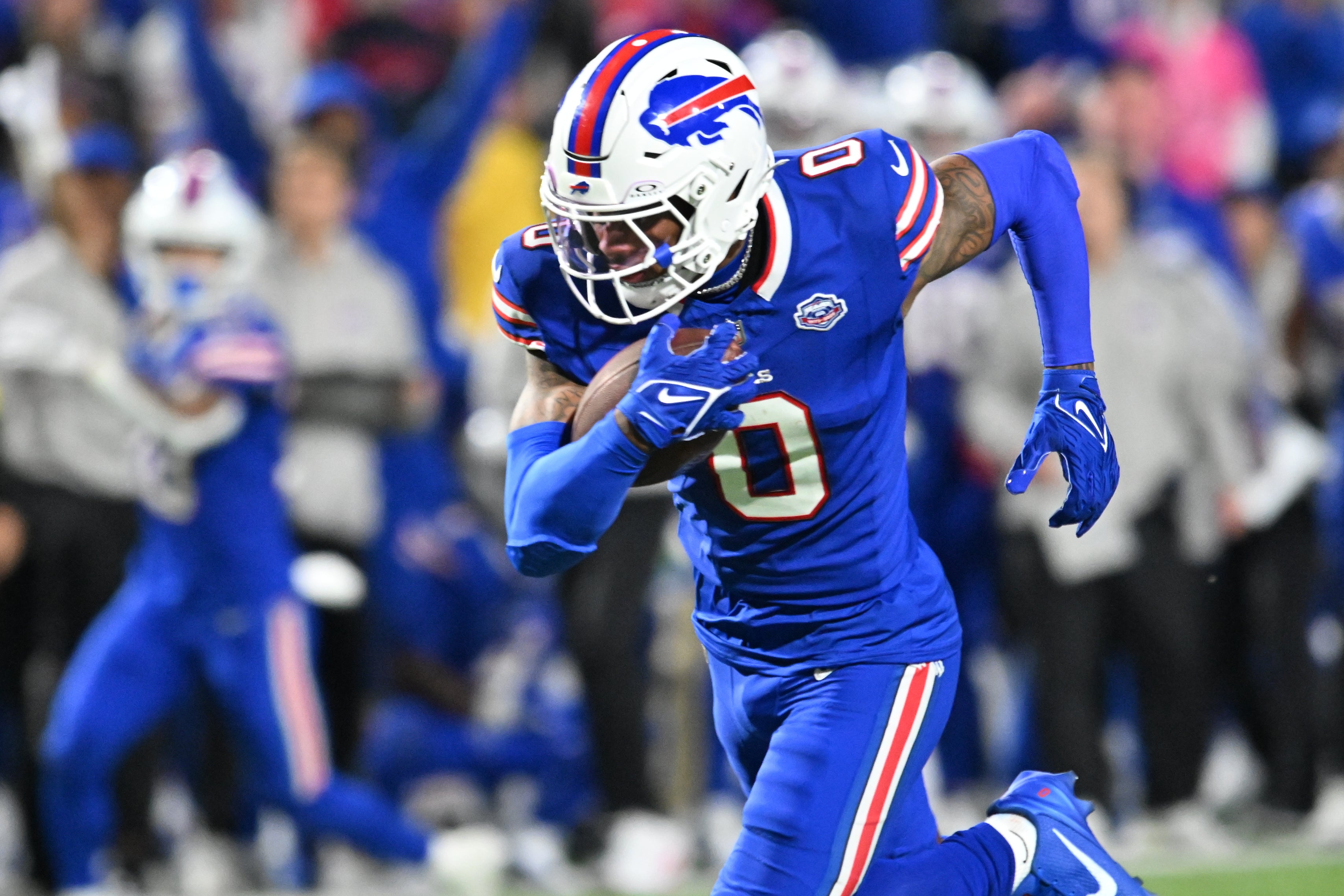 Sep 7, 2025; Orchard Park, New York, USA; Buffalo Bills wide receiver Keon Coleman (0) runs the ball during the fourth quarter against the Baltimore Ravens at Highmark Stadium.