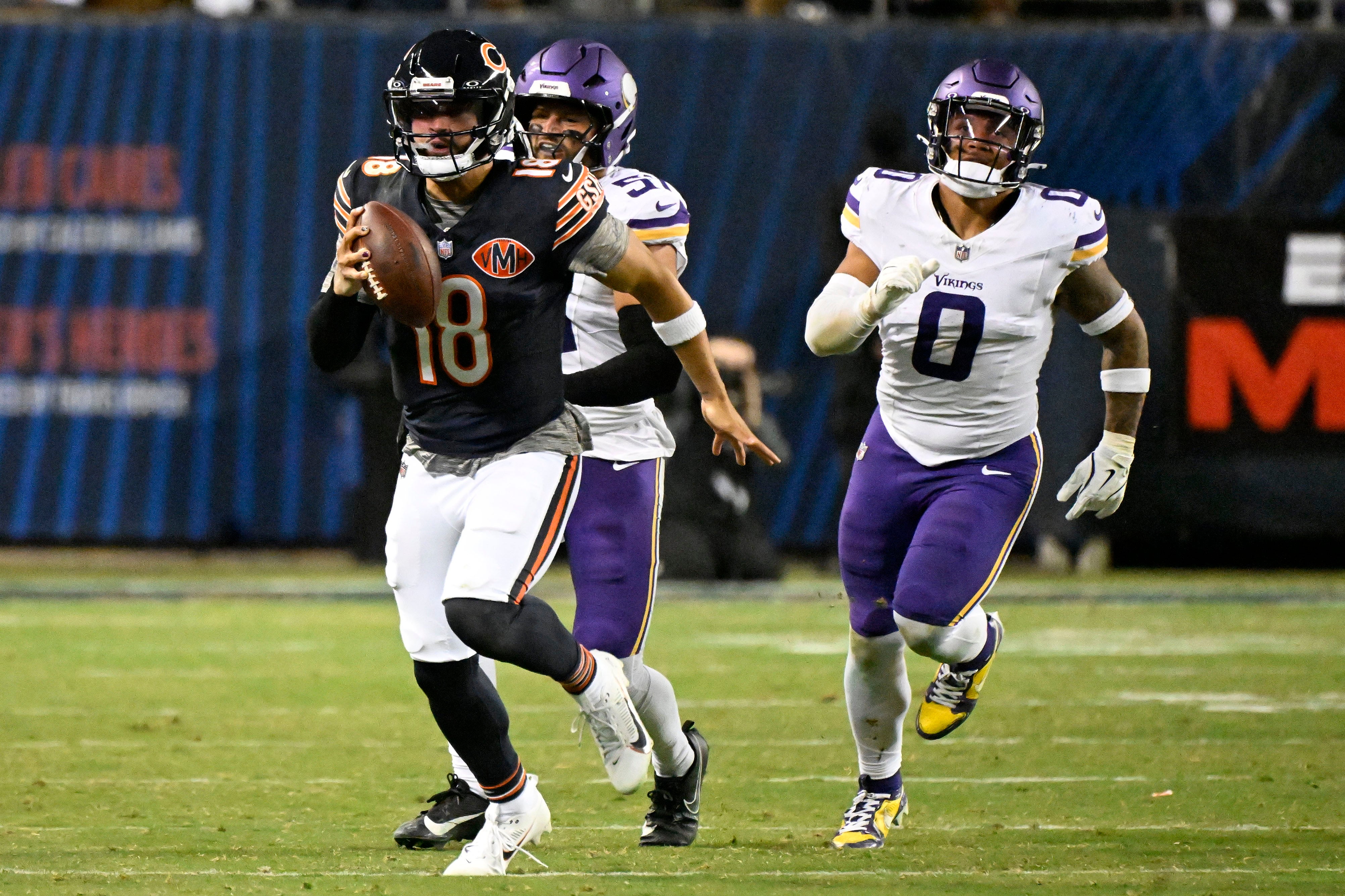 Sep 8, 2025; Chicago, Illinois, USA; Chicago Bears quarterback Caleb Williams (18) rushes the ball against the Minnesota Vikings during the second half at Soldier Field.