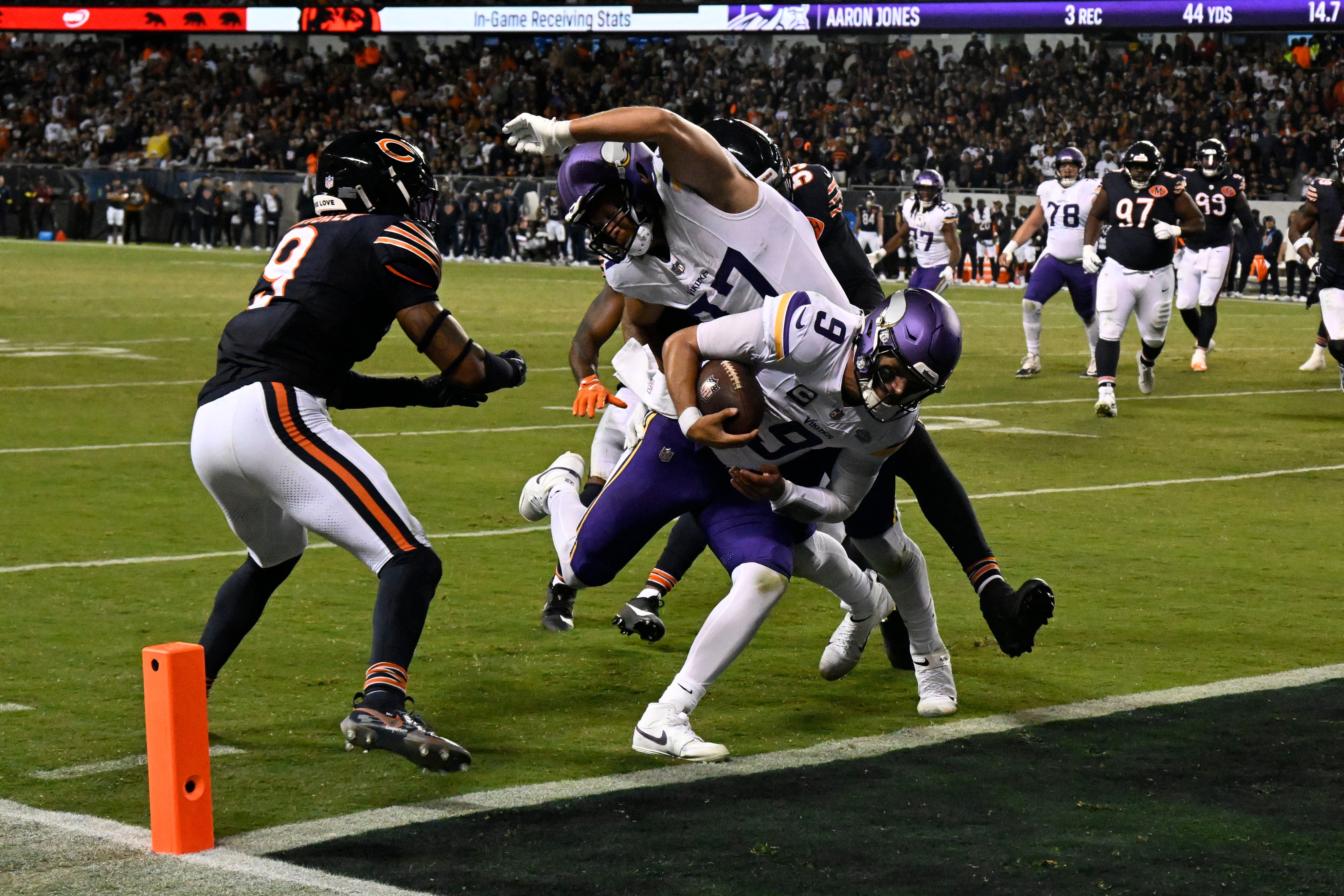 Sep 8, 2025; Chicago, Illinois, USA; Minnesota Vikings quarterback J.J. McCarthy (9) rushes for a touchdown against the Chicago Bears during the second half at Soldier Field.