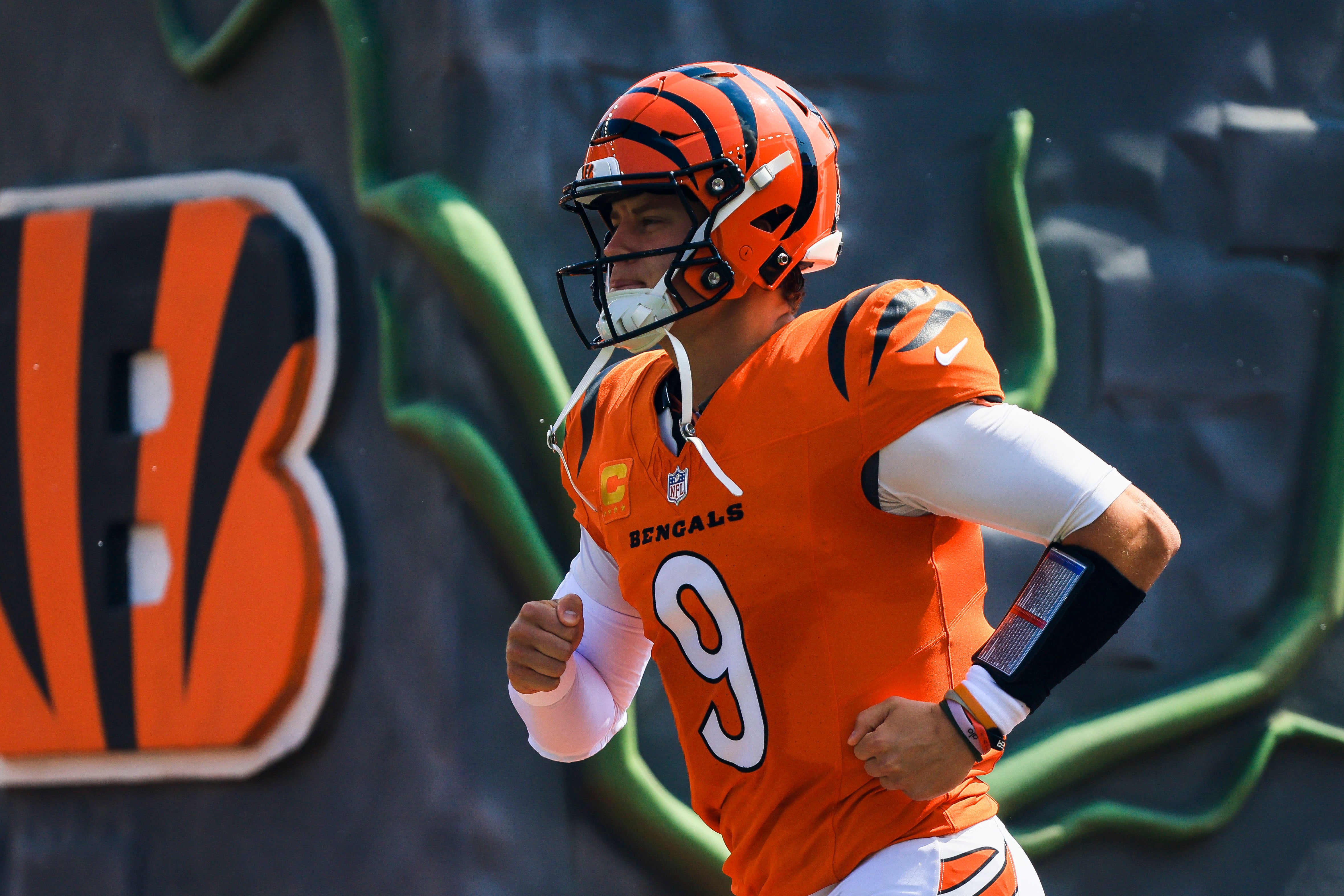 Sep 14, 2025; Cincinnati, Ohio, USA; Cincinnati Bengals quarterback Joe Burrow (9) runs onto the field before the game against the Jacksonville Jaguars at Paycor Stadium.