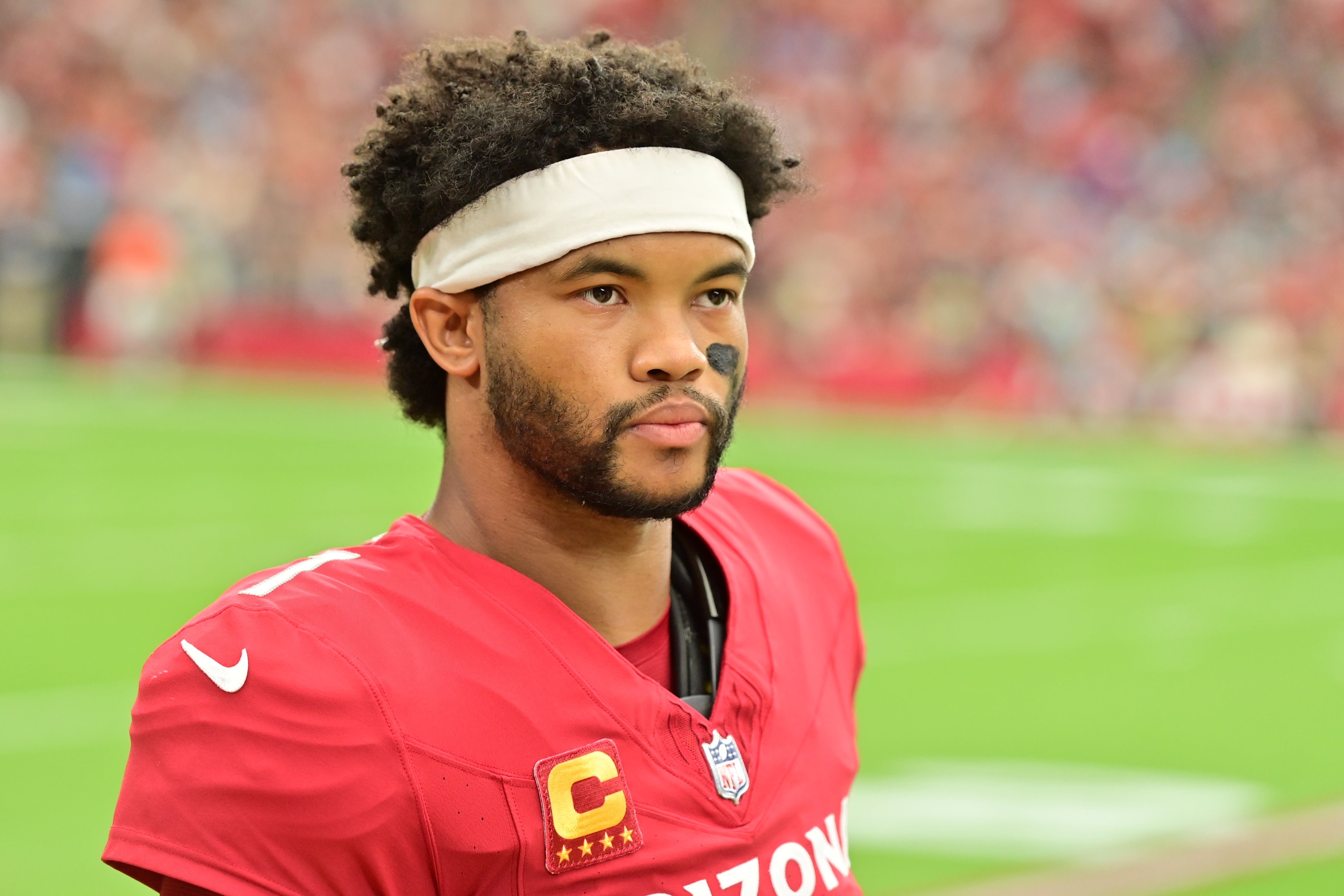 Sep 14, 2025; Glendale, Arizona, USA; Arizona Cardinals quarterback Kyler Murray (1) looks on during the first quarter against the Carolina Panthers at State Farm Stadium. Mandatory Credit: Matt Kartozian-Imagn Images