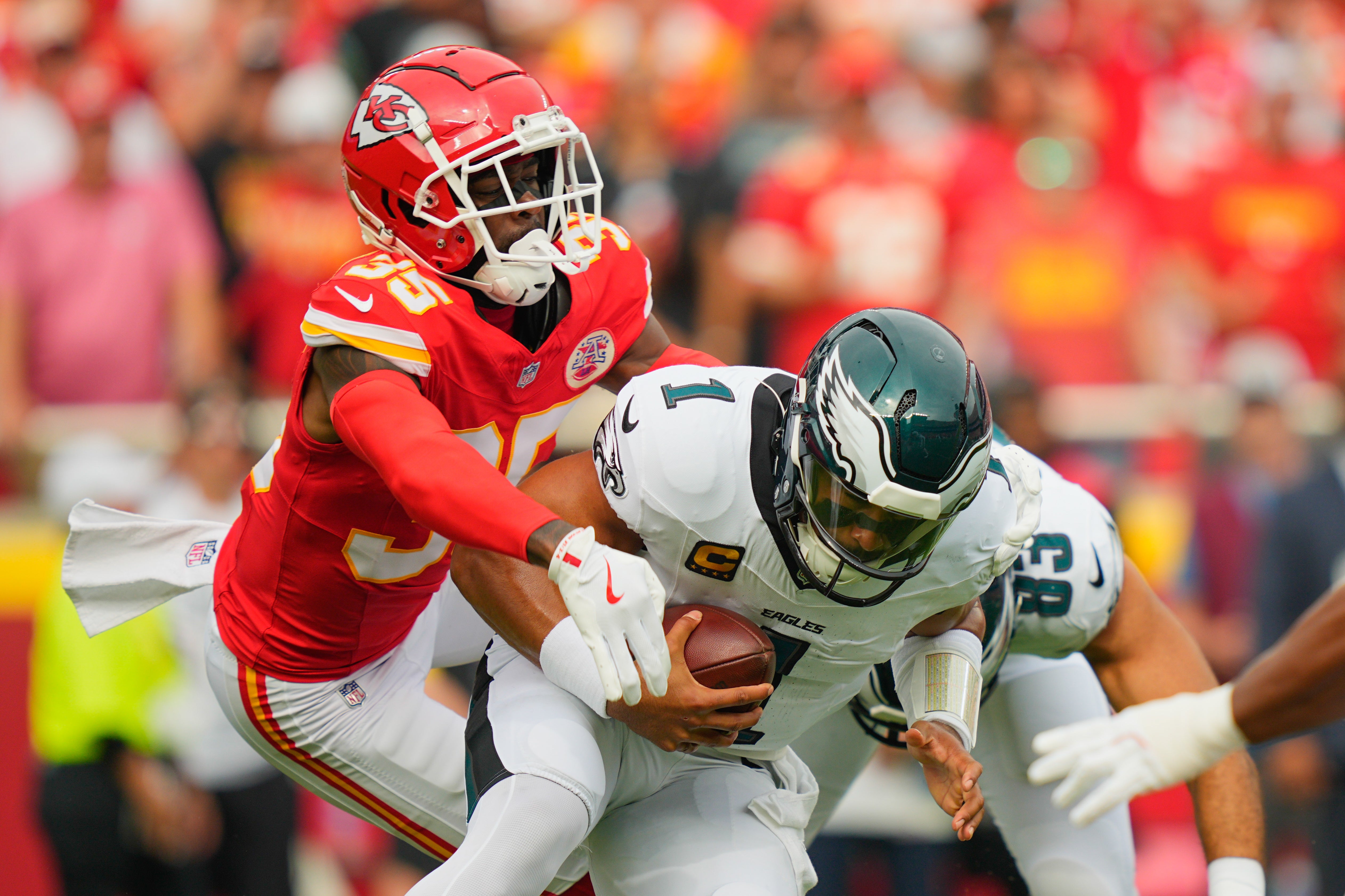 Kansas City Chiefs cornerback Jaylen Watson (35) sacks Philadelphia Eagles quarterback Jalen Hurts (1)
