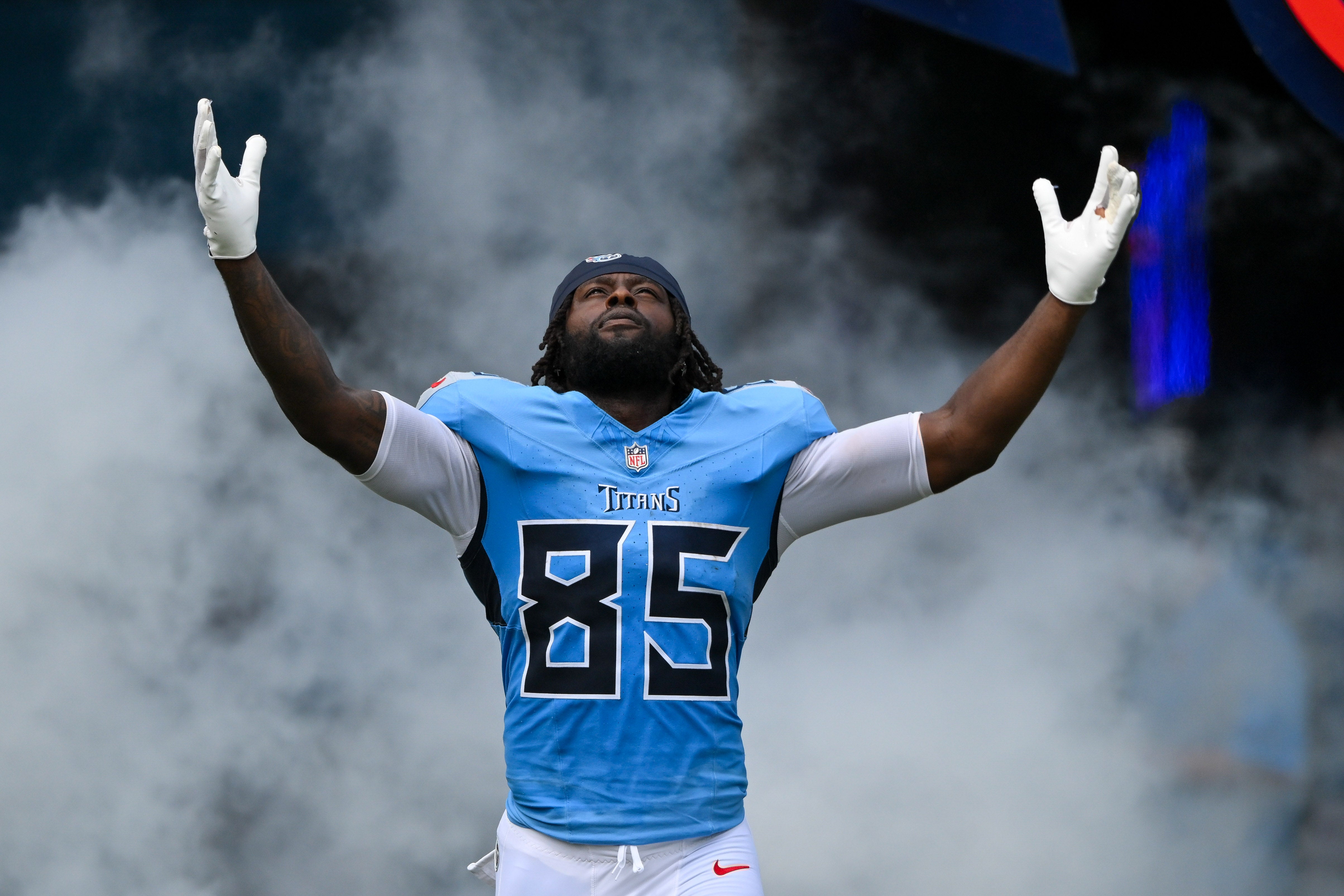 Sep 14, 2025; Nashville, Tennessee, USA; Tennessee Titans tight end Chigoziem Okonkwo (85) takes the field against the Los Angeles Rams during the first half at Nissan Stadium.