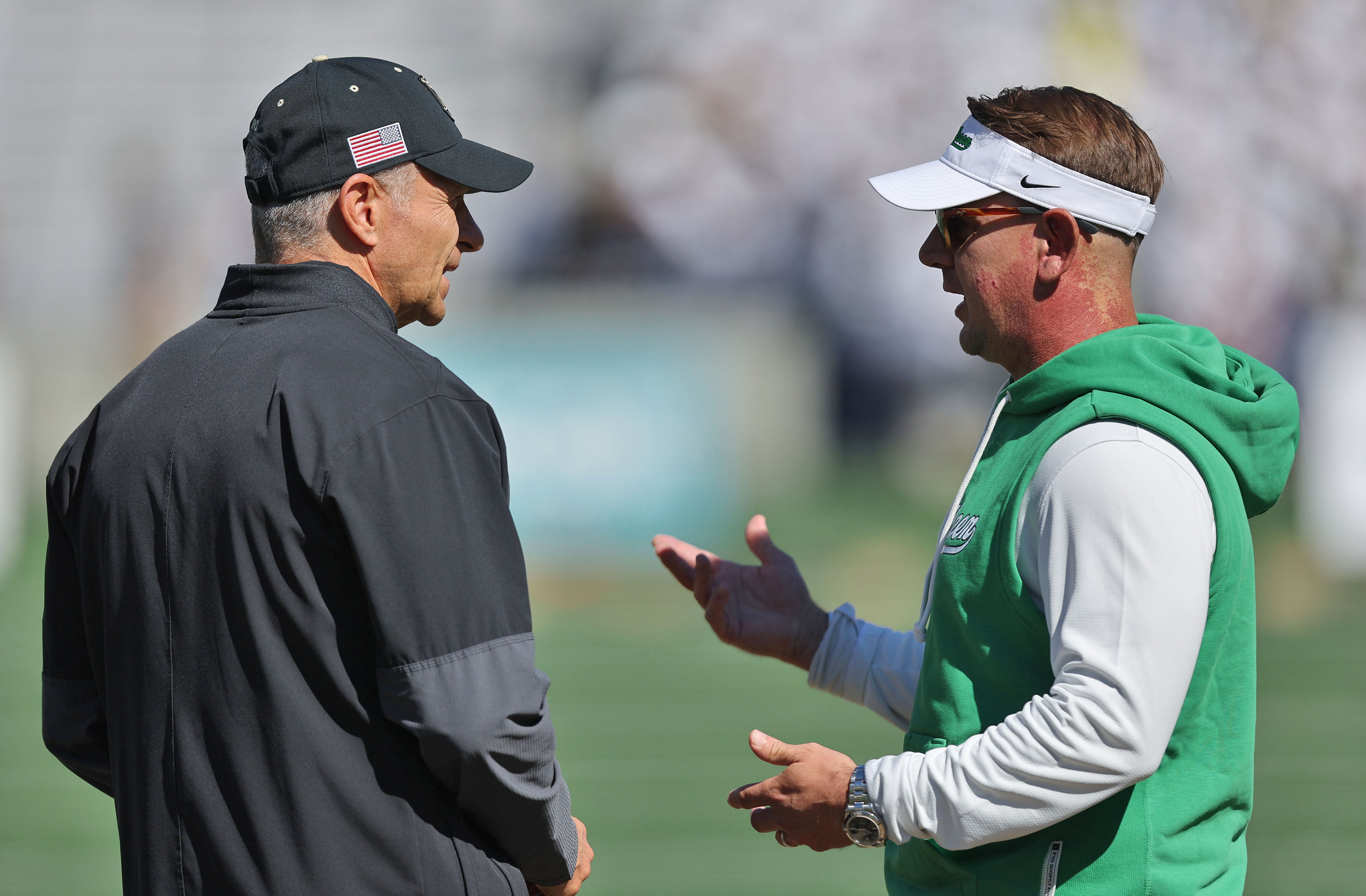 Sep 20, 2025; West Point, New York, USA; Army Black Knights head coach Jeff Monken and North Texas Mean Green head coach Eric Morris chat before the first half at Michie Stadium. Mandatory Credit: Danny Wild-Imagn Images
