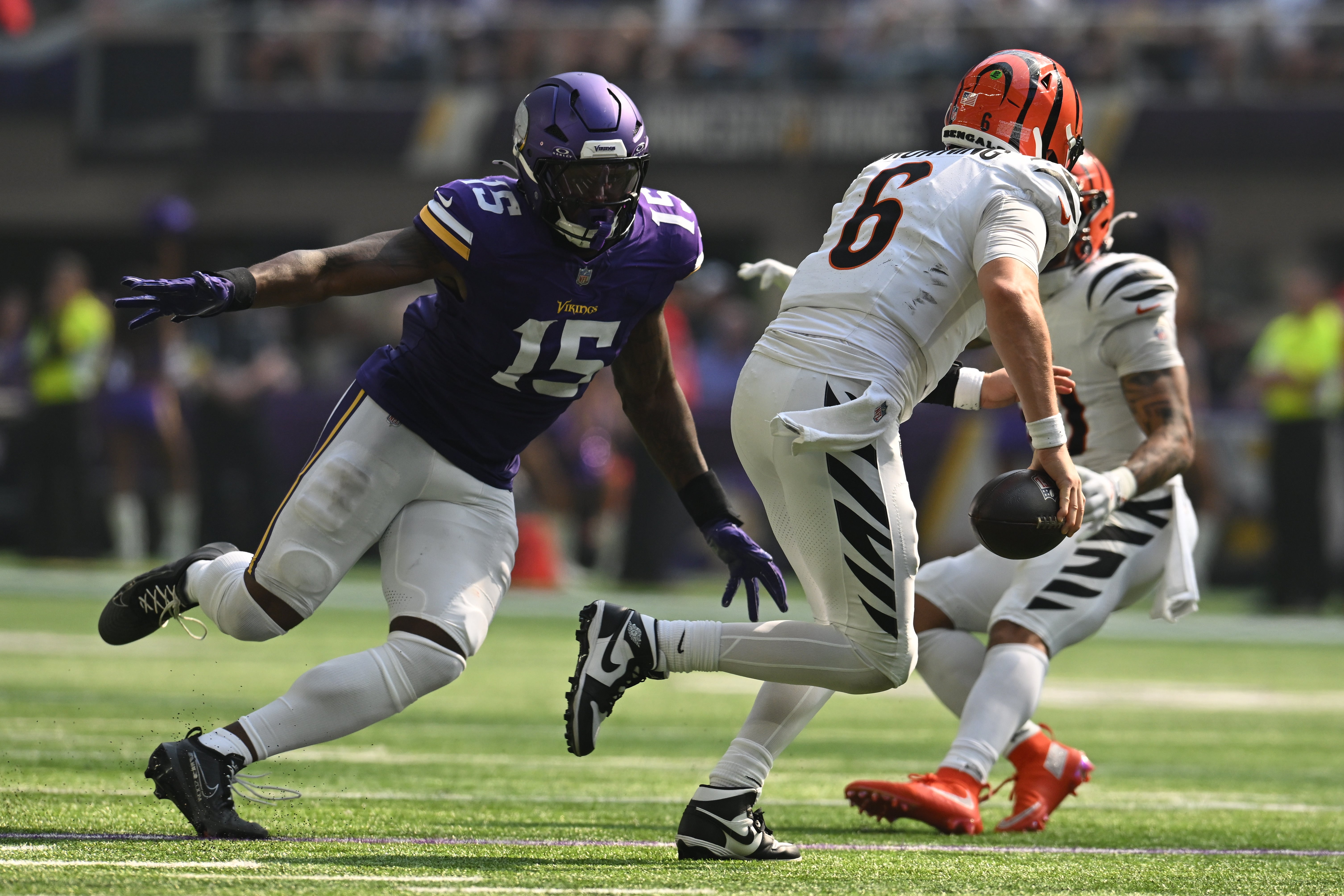 Sep 21, 2025; Minneapolis, Minnesota, USA; Minnesota Vikings linebacker Dallas Turner (15) applies the pressure on Cincinnati Bengals quarterback Jake Browning (6) during the second half at U.S. Bank Stadium.