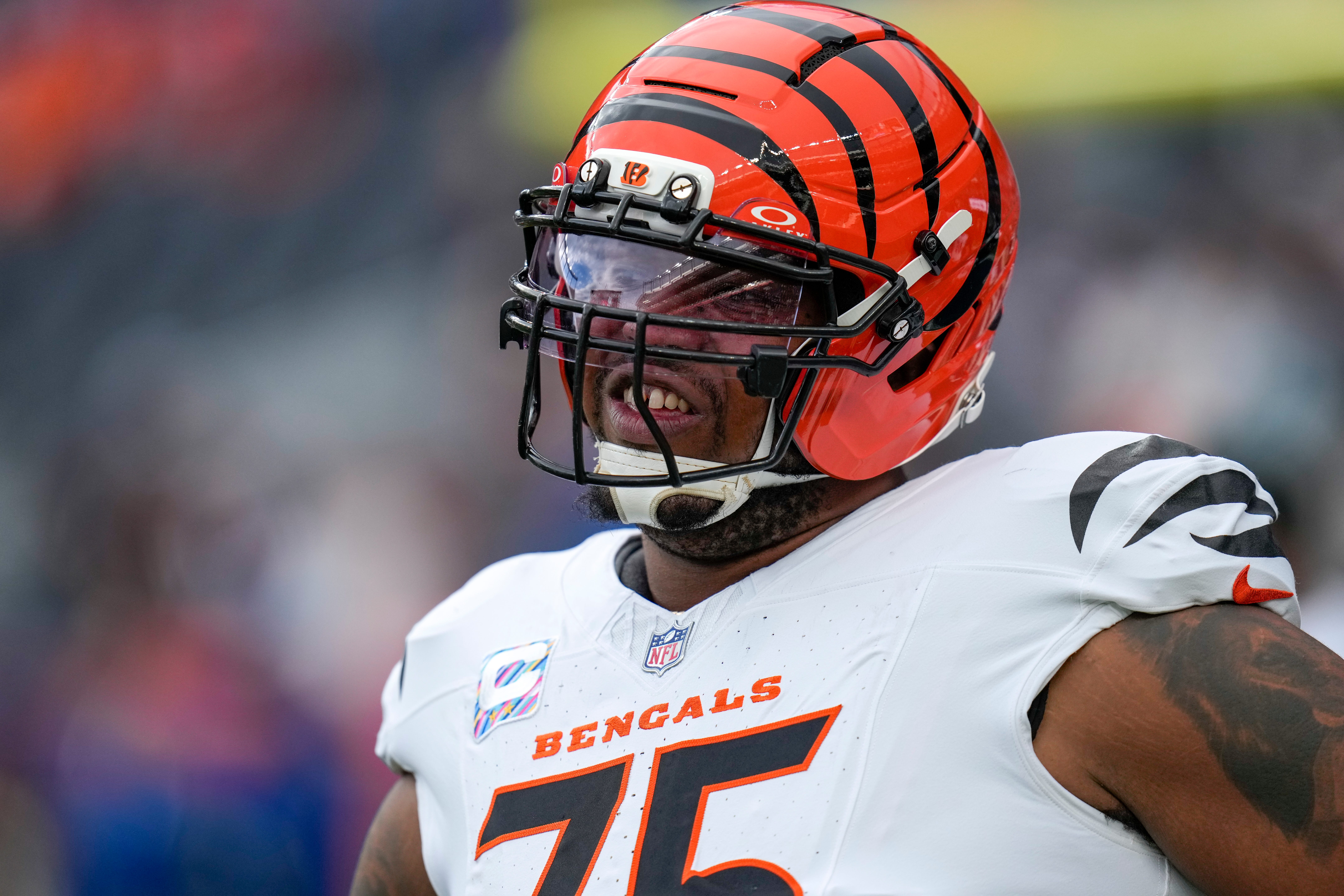 Cincinnati Bengals offensive tackle Orlando Brown Jr. (75) stretches before the first quarter of the NFL Week 4 Monday Night Football game between the Denver Broncos and the Cincinnati Bengals at Empower Field at Mile High in Denver on Monday, Sept. 29, 2025.