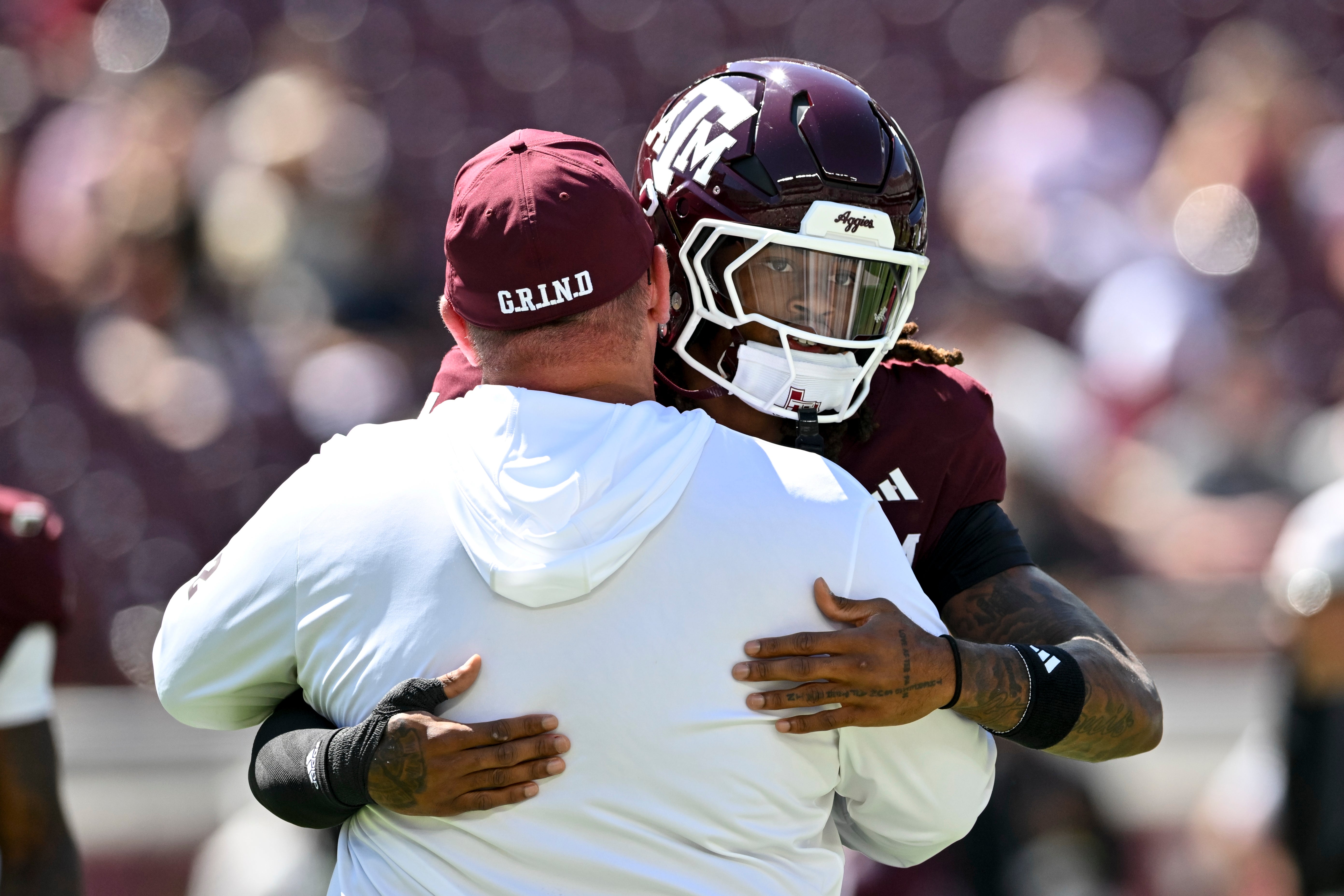 Sep 27, 2025; College Station, Texas, USA; Texas A&M Aggies head coach Mike Elko greets cornerback Will Lee III (4) prior to the game against the Auburn Tigers at Kyle Field.