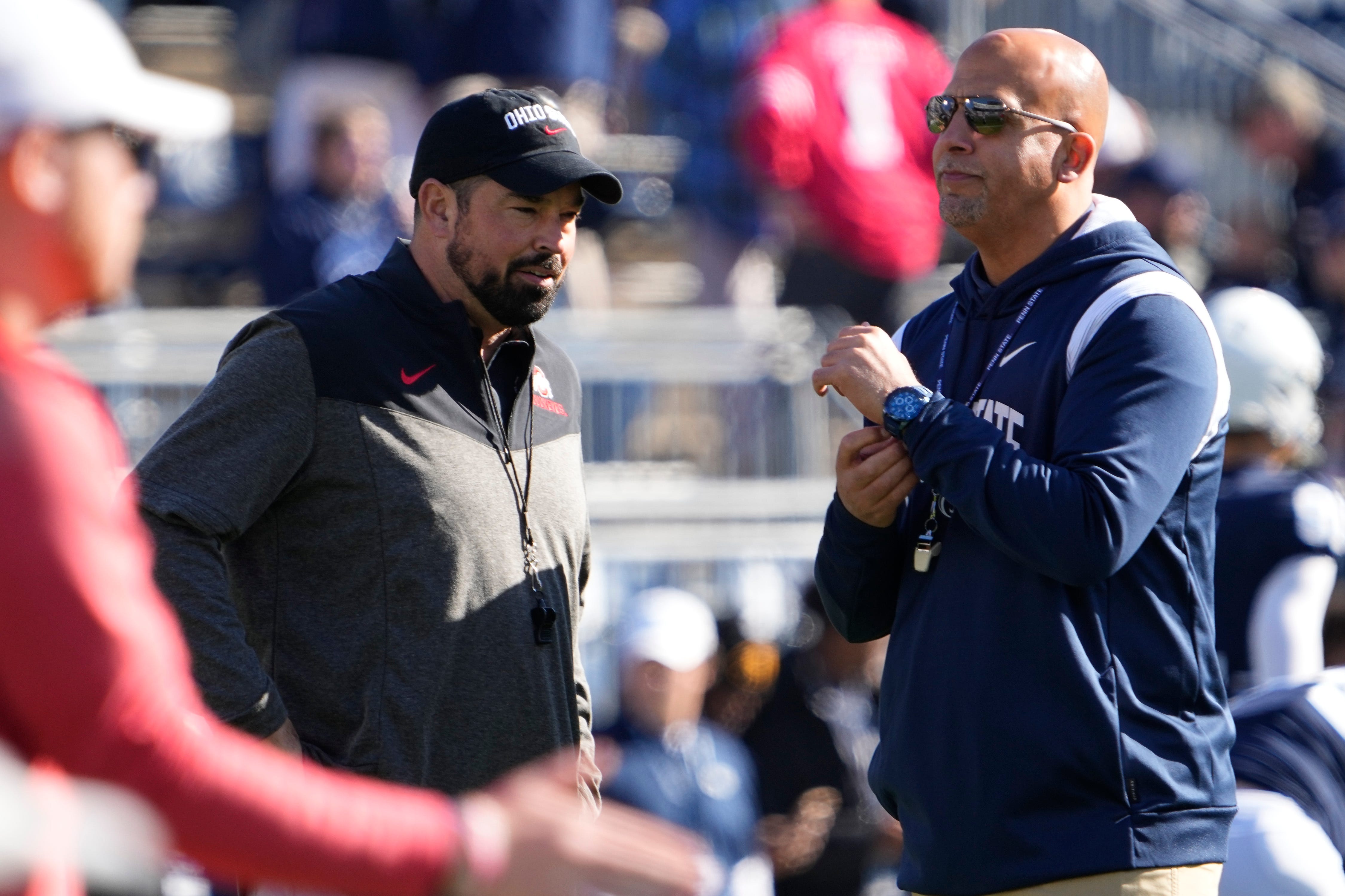 Oct 29, 2022; University Park, Pennsylvania, USA; Ohio State Buckeyes head coach Ryan Day talks to Penn State Nittany Lions head coach James Franklin prior to the NCAA Division I football game at Beaver Stadium.