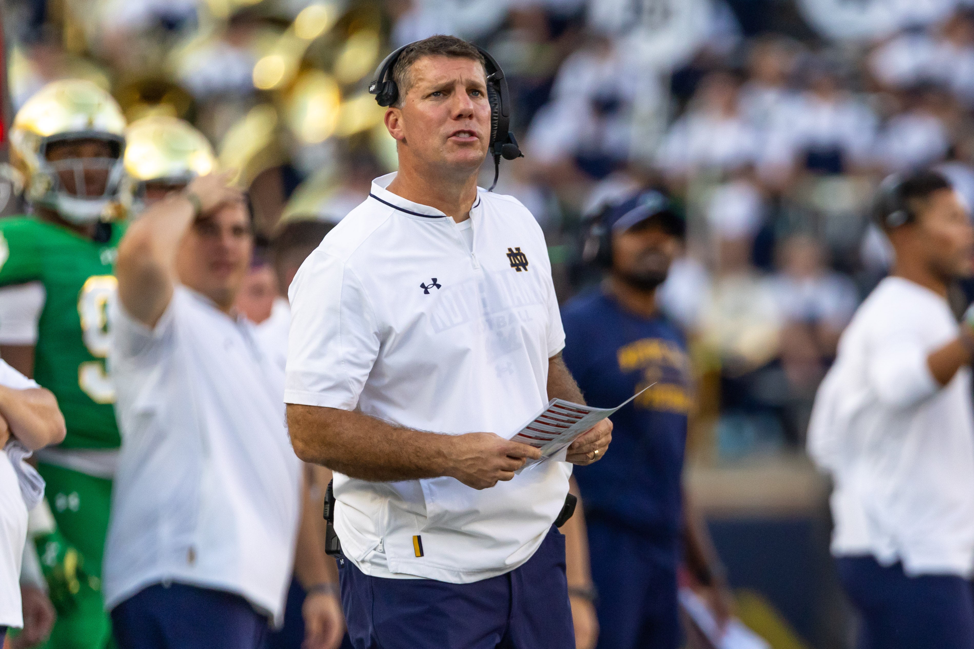 Oct 4, 2025; South Bend, Indiana, USA; Notre Dame defensive coordinator Chris Ash looks to the scoreboard against the Boise State Broncos during the second half at Notre Dame Stadium. Mandatory Credit: Michael Caterina-Imagn Images