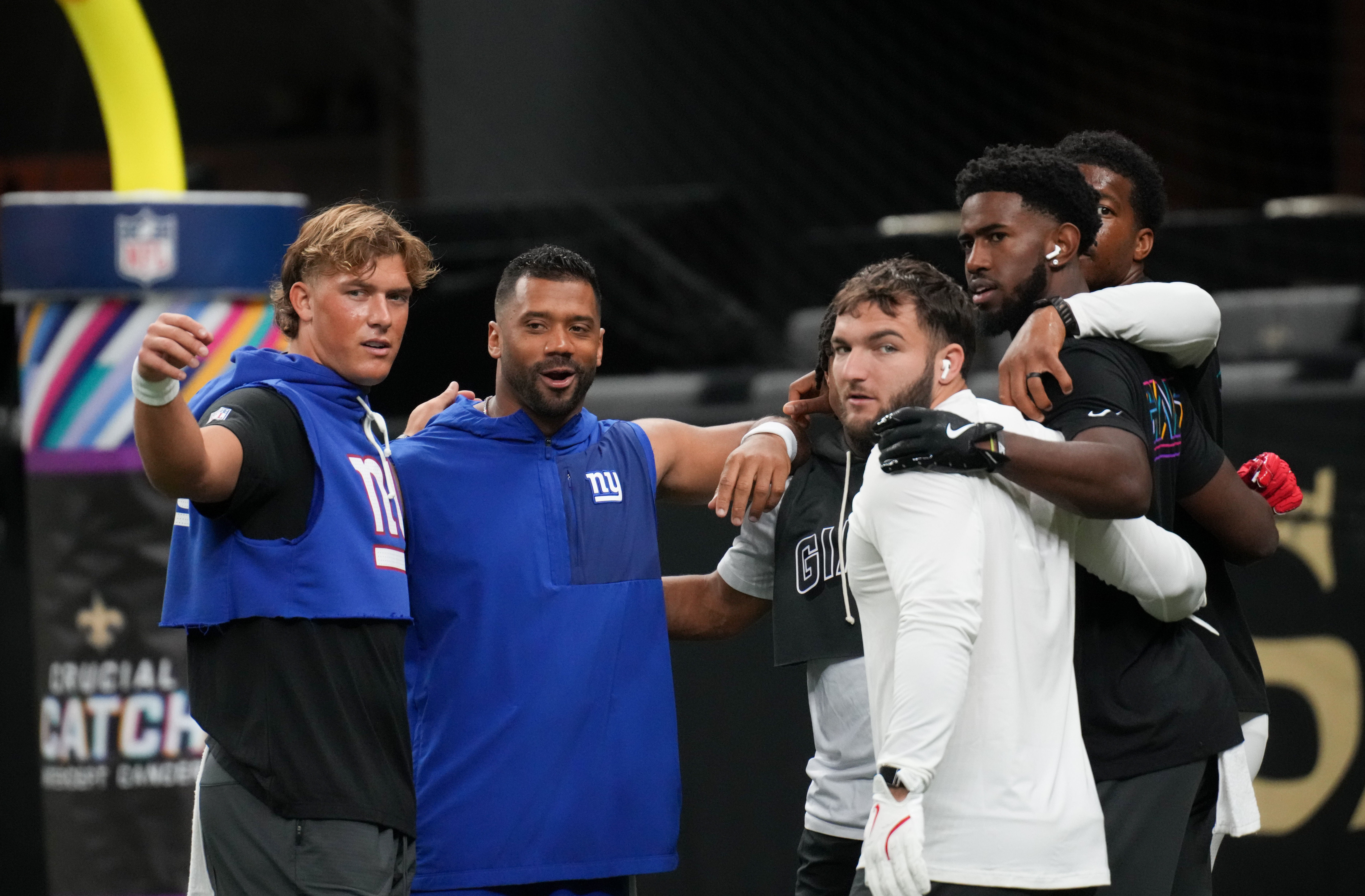 Oct 5, 2025; New Orleans, Louisiana, USA; New York Giants quarterback Jaxson Dart (6) and New York Giants quarterback Russell Wilson (3) huddle up their teammates prior to the game against the New Orleans Saints at Caesars Superdome.