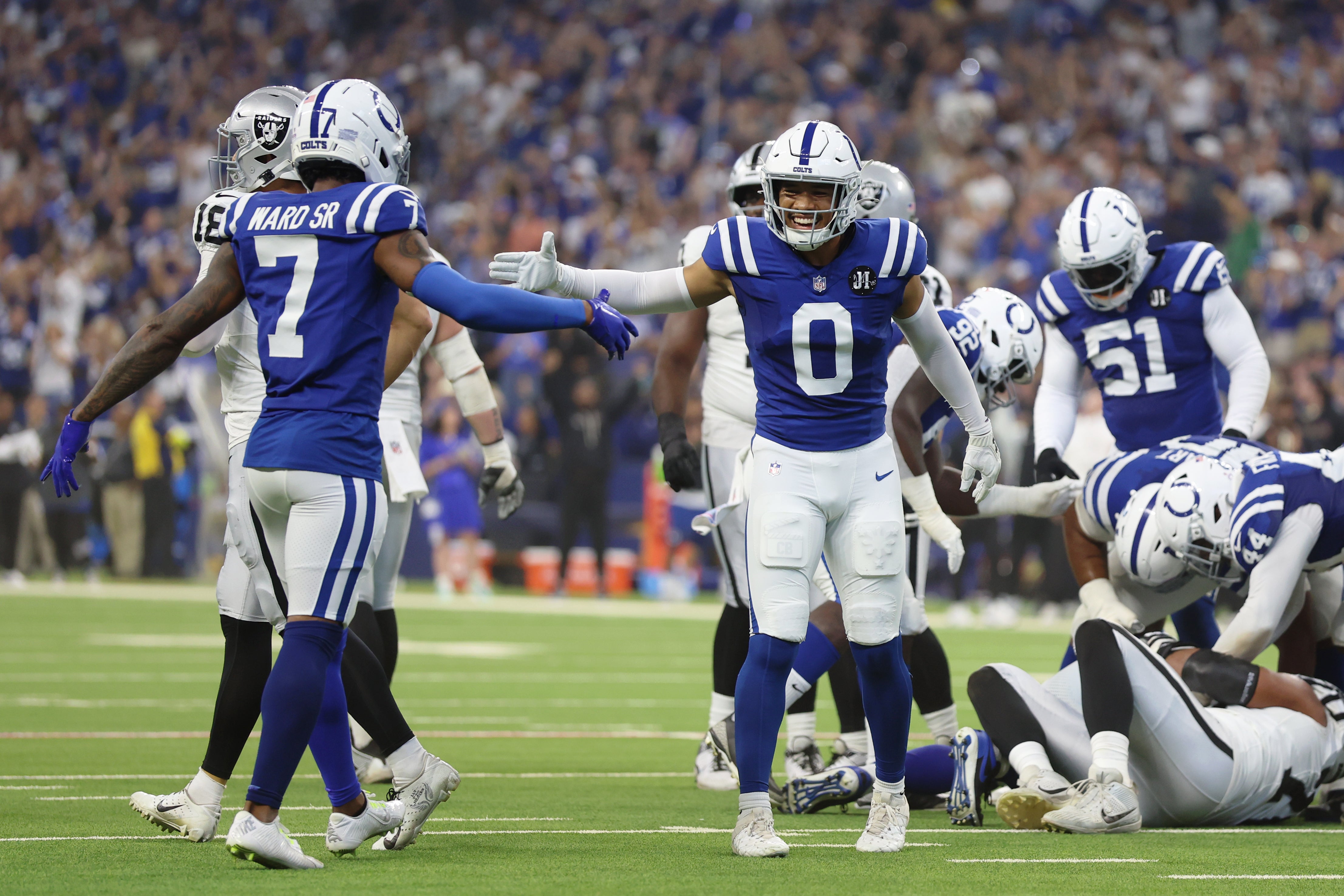 Colts DBs Charvarius Ward and Cam Bynum celebrate after a play