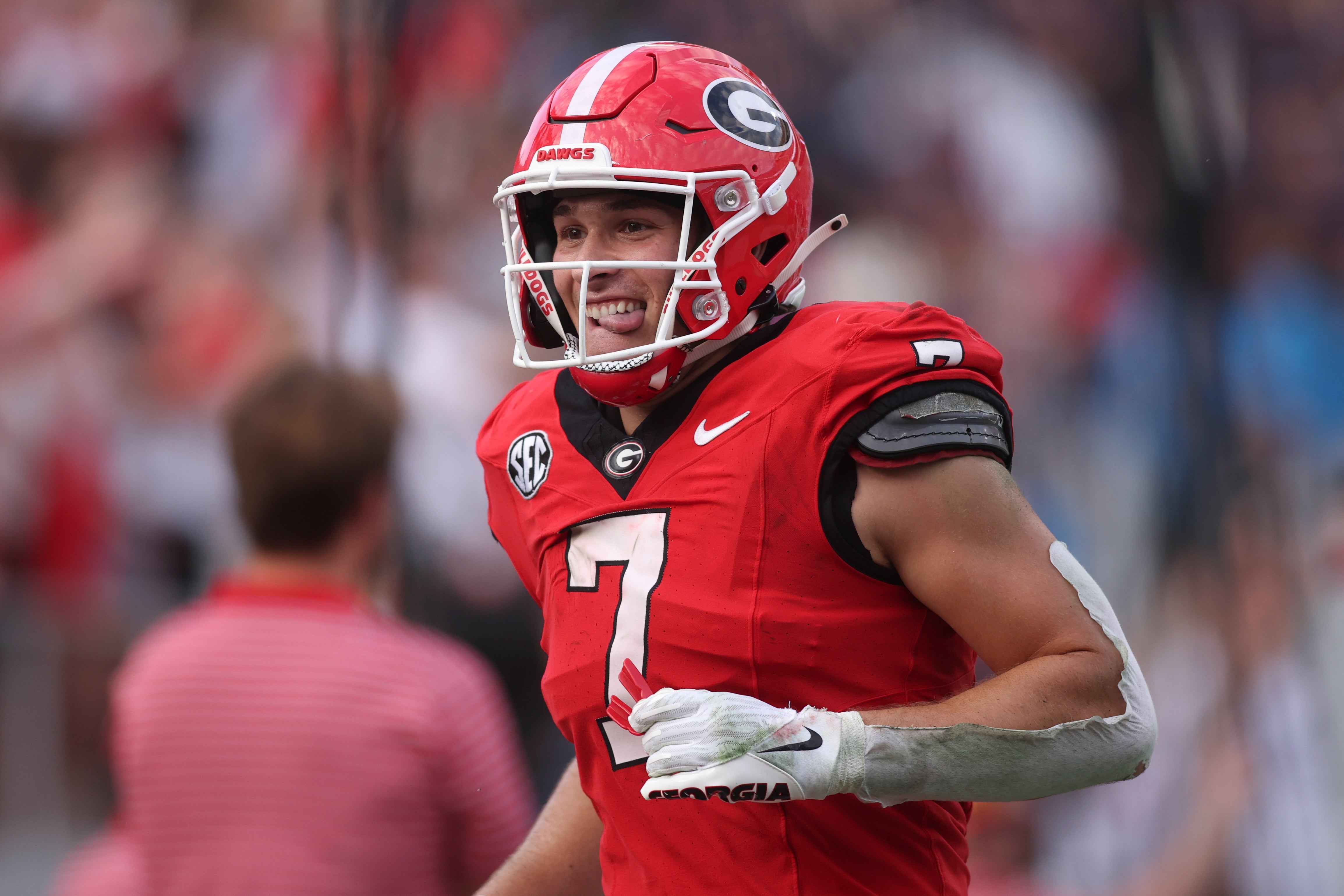 Georgia Bulldogs tight end Lawson Luckie (7) reacts after a touchdown against the Mississippi Rebels during the third quarter of the game at Sanford Stadium.