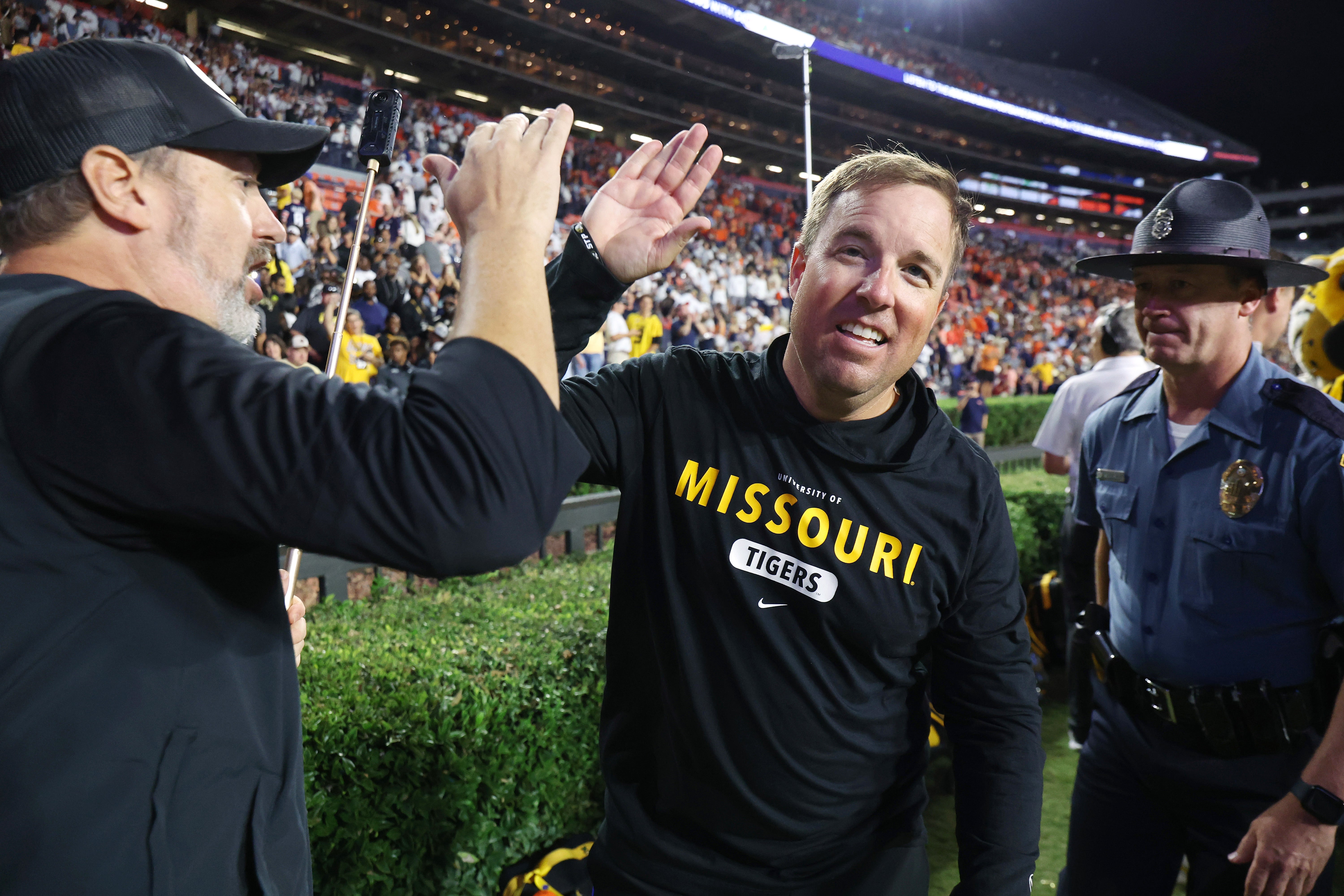 Oct 18, 2025; Auburn, Alabama, USA; Missouri Tigers head coach Eli Drinkwitz celebrates after his team beat the Auburn Tigers in overtime at Jordan-Hare Stadium. Mandatory Credit: John Reed-Imagn Images