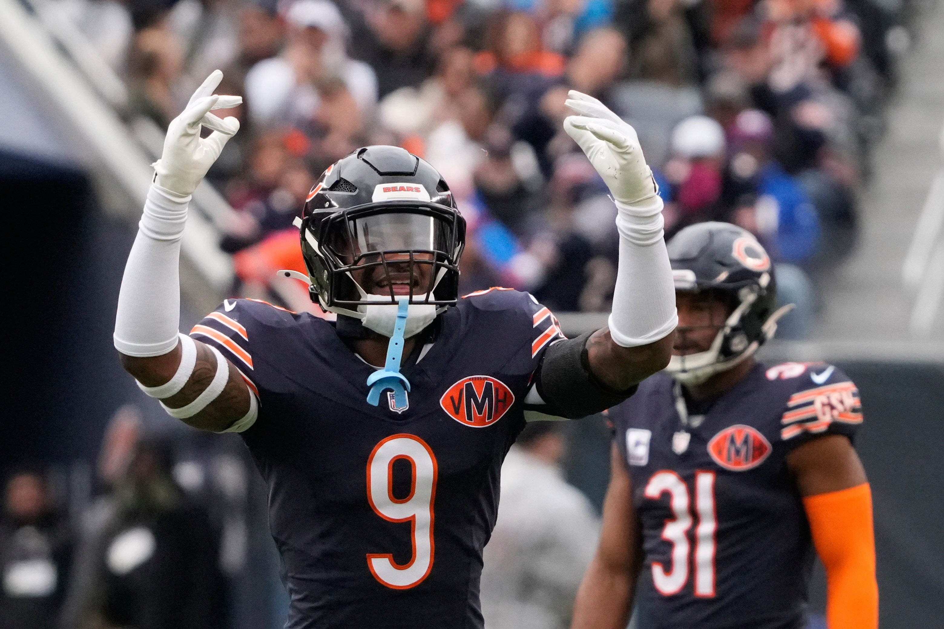 Oct 19, 2025; Chicago, Illinois, USA; Chicago Bears safety Jaquan Brisker (9) reacts after making a defensive play against the New Orleans Saints during the first half at Soldier Field.