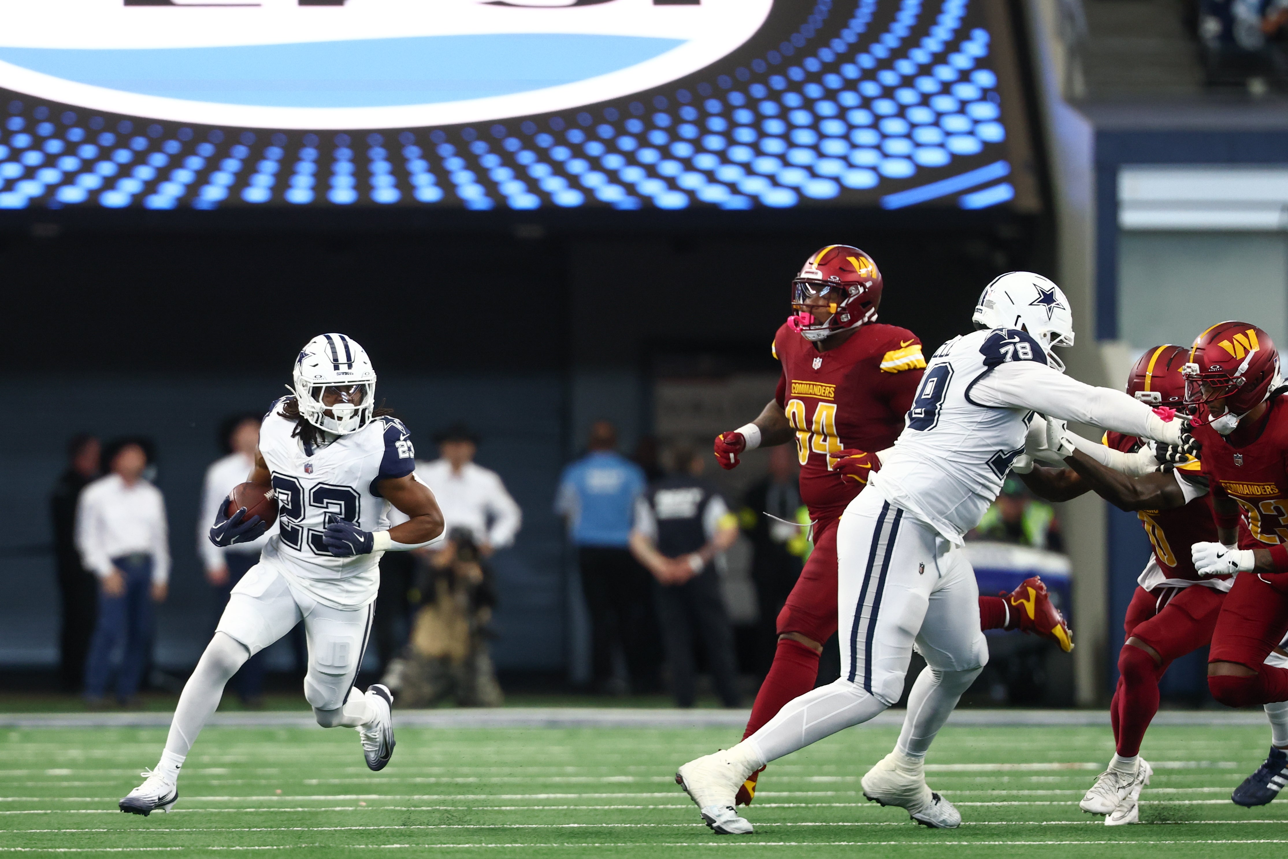Oct 19, 2025; Arlington, Texas, USA; Dallas Cowboys running back Jaydon Blue (23) carries the ball against the Washington Commanders during the first quarter of the game at AT&T Stadium.