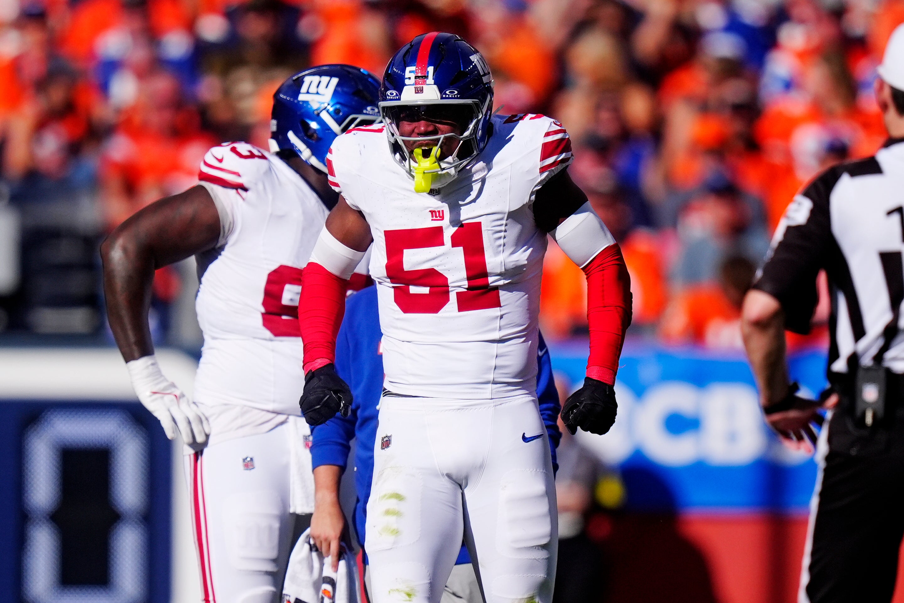 Oct 19, 2025; Denver, Colorado, USA; New York Giants linebacker Abdul Carter (51) reacts after a play against the Denver Broncos during the second half at Empower Field at Mile High.