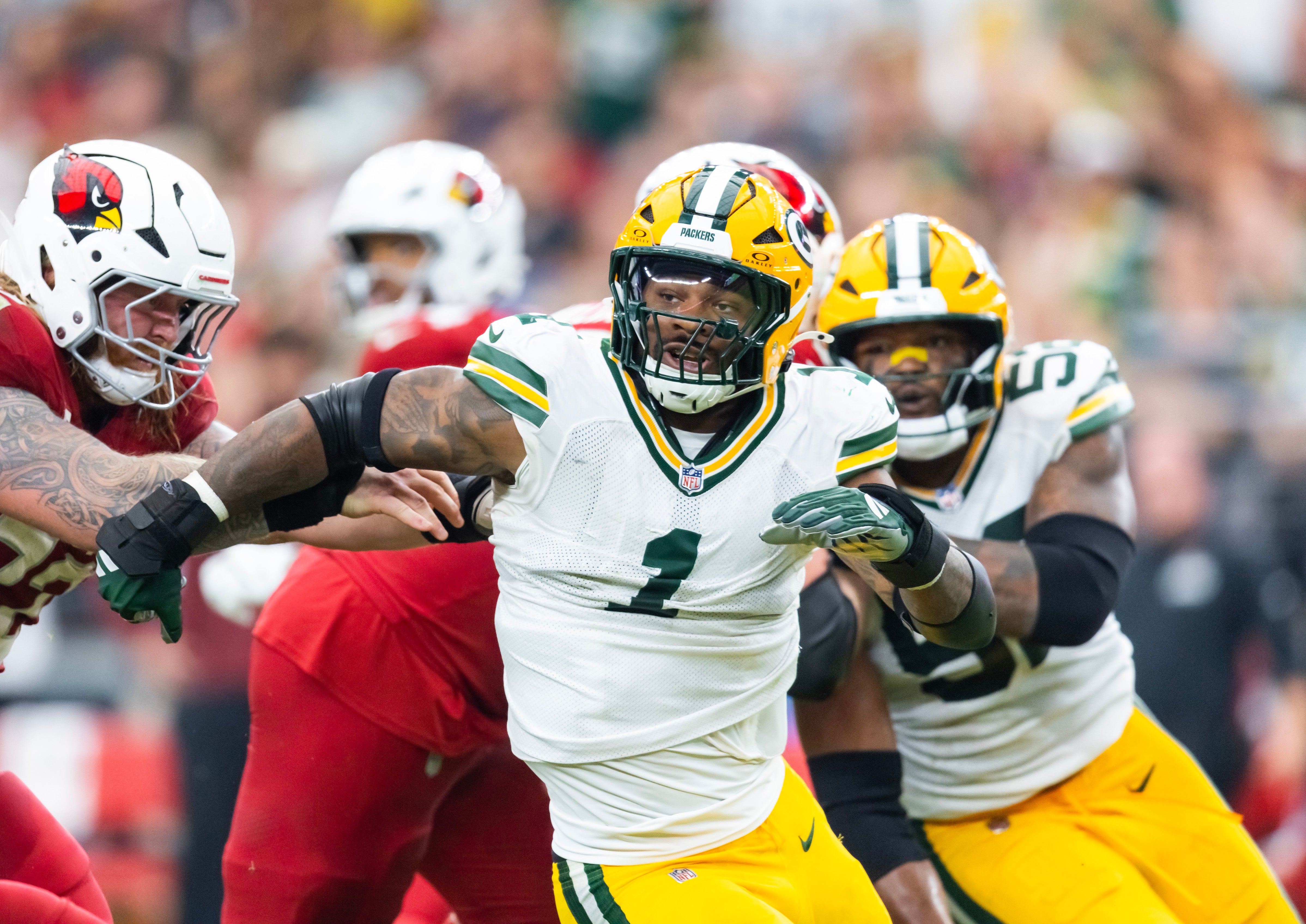 Oct 19, 2025; Glendale, Arizona, USA; Green Bay Packers defensive lineman Micah Parsons (1) against the Arizona Cardinals at State Farm Stadium.