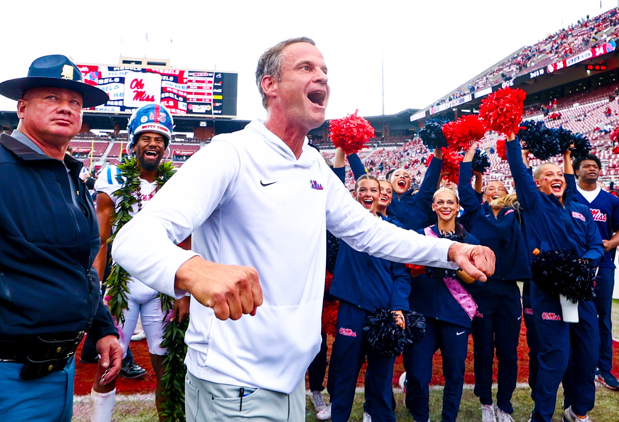 Oct 25, 2025; Norman, Oklahoma, USA; Ole Miss Rebels head coach Lane Kiffin celebrates with fans after the game against the Oklahoma Sooners at Gaylord Family-Oklahoma Memorial Stadium.