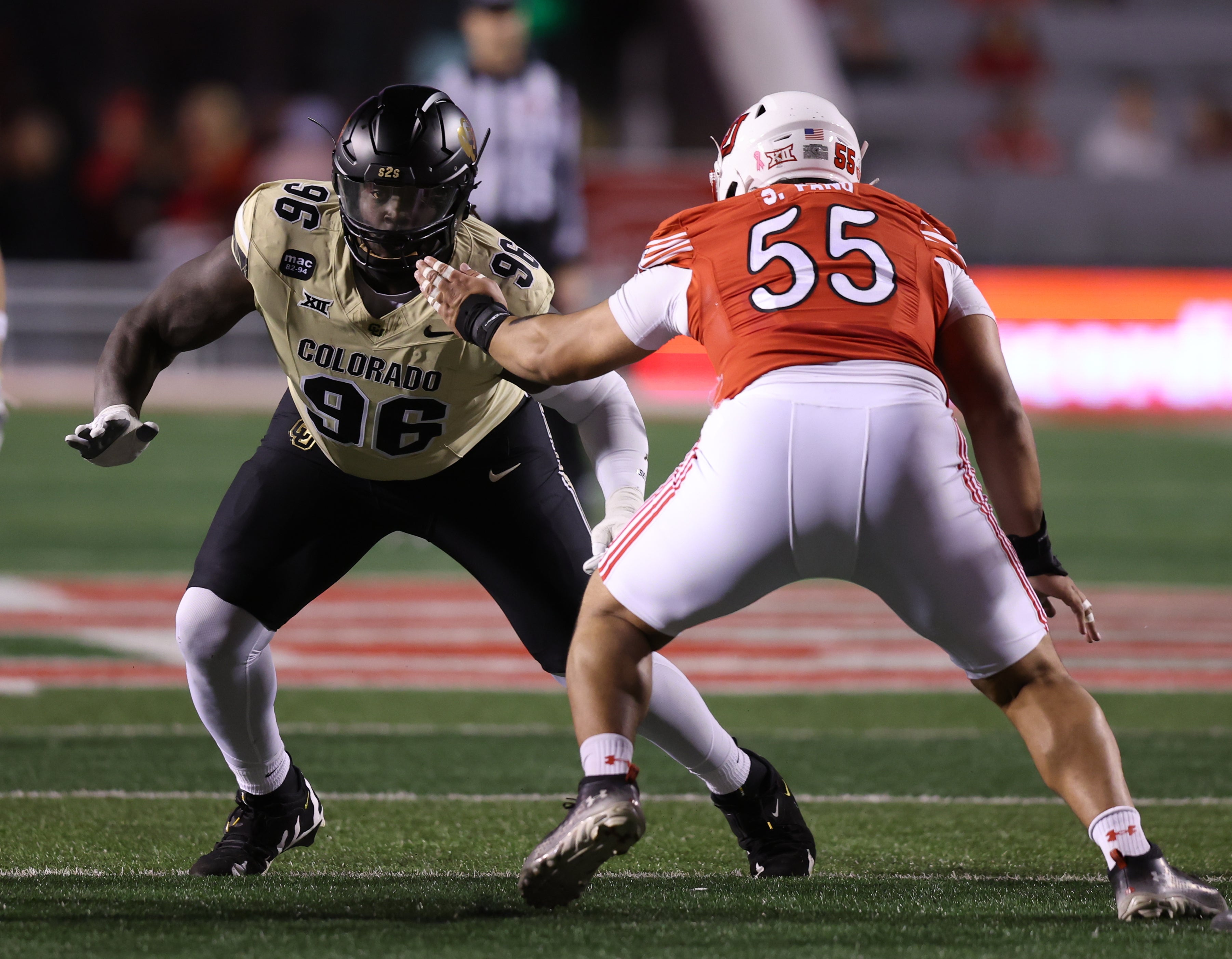 Oct 25, 2025; Salt Lake City, Utah, USA; Colorado Buffaloes defensive lineman Jehiem Oatis (96) and Utah Utes offensive lineman Spencer Fano (55) battle during the first quarter at Rice-Eccles Stadium. Mandatory Credit: Rob Gray-Imagn Images