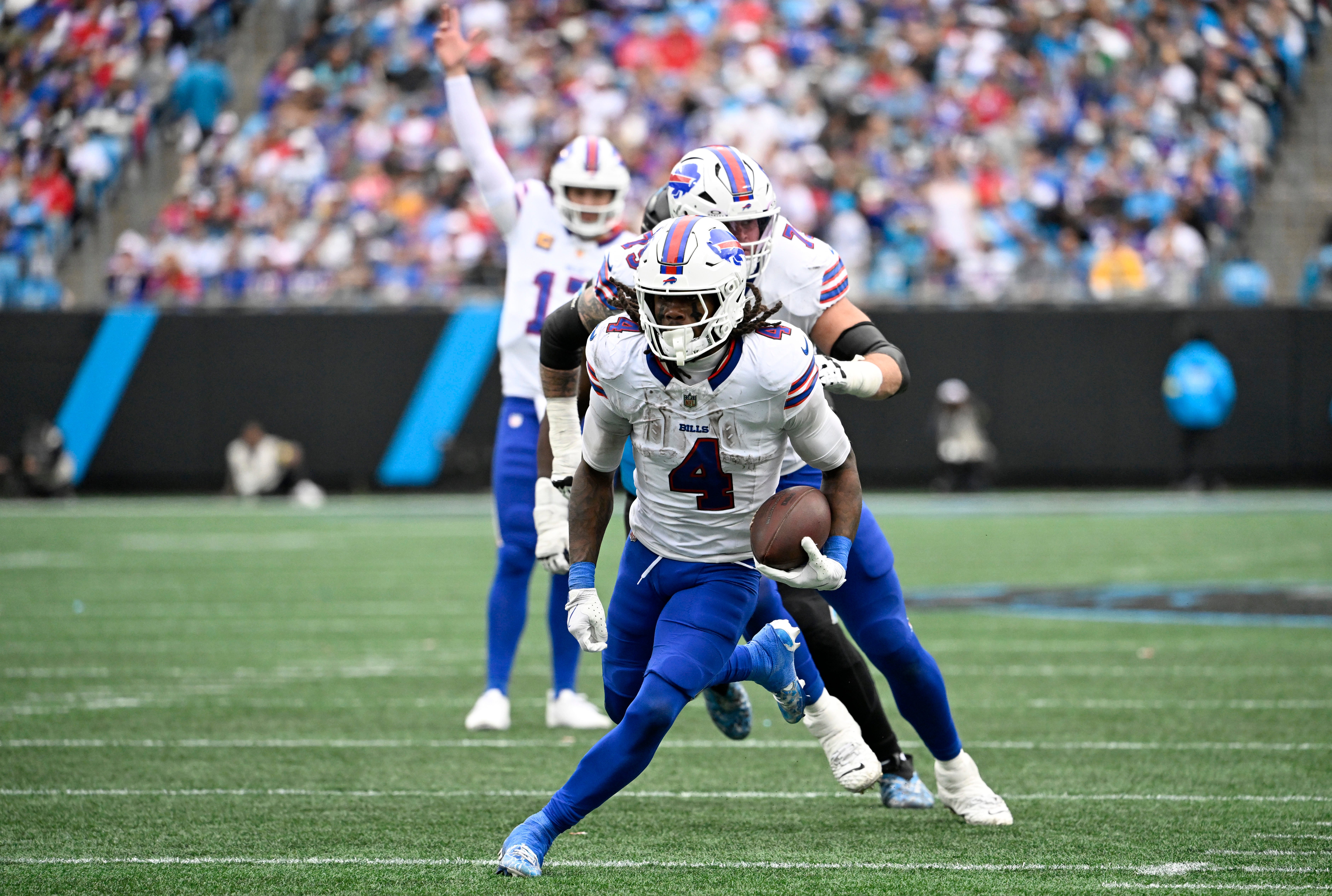 Oct 26, 2025; Charlotte, North Carolina, USA; Buffalo Bills running back James Cook III (4) scores a touchdown during the second half against the Carolina Panthers at Bank of America Stadium.