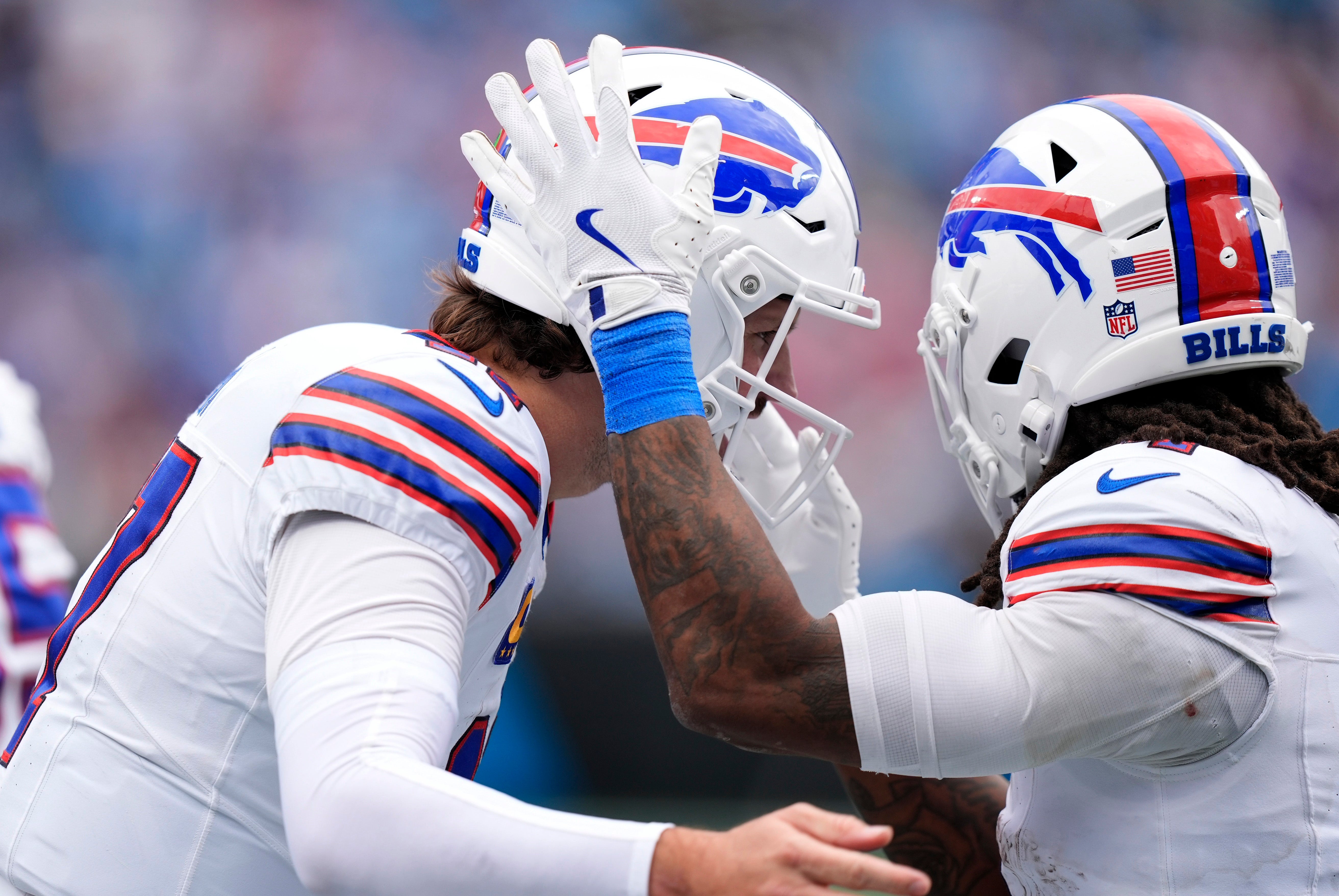 Oct 26, 2025; Charlotte, North Carolina, USA; Buffalo Bills running back James Cook III (4) celebrates with quarterback Josh Allen (17) after scoring a touchdown during the second half against the Carolina Panthers at Bank of America Stadium.