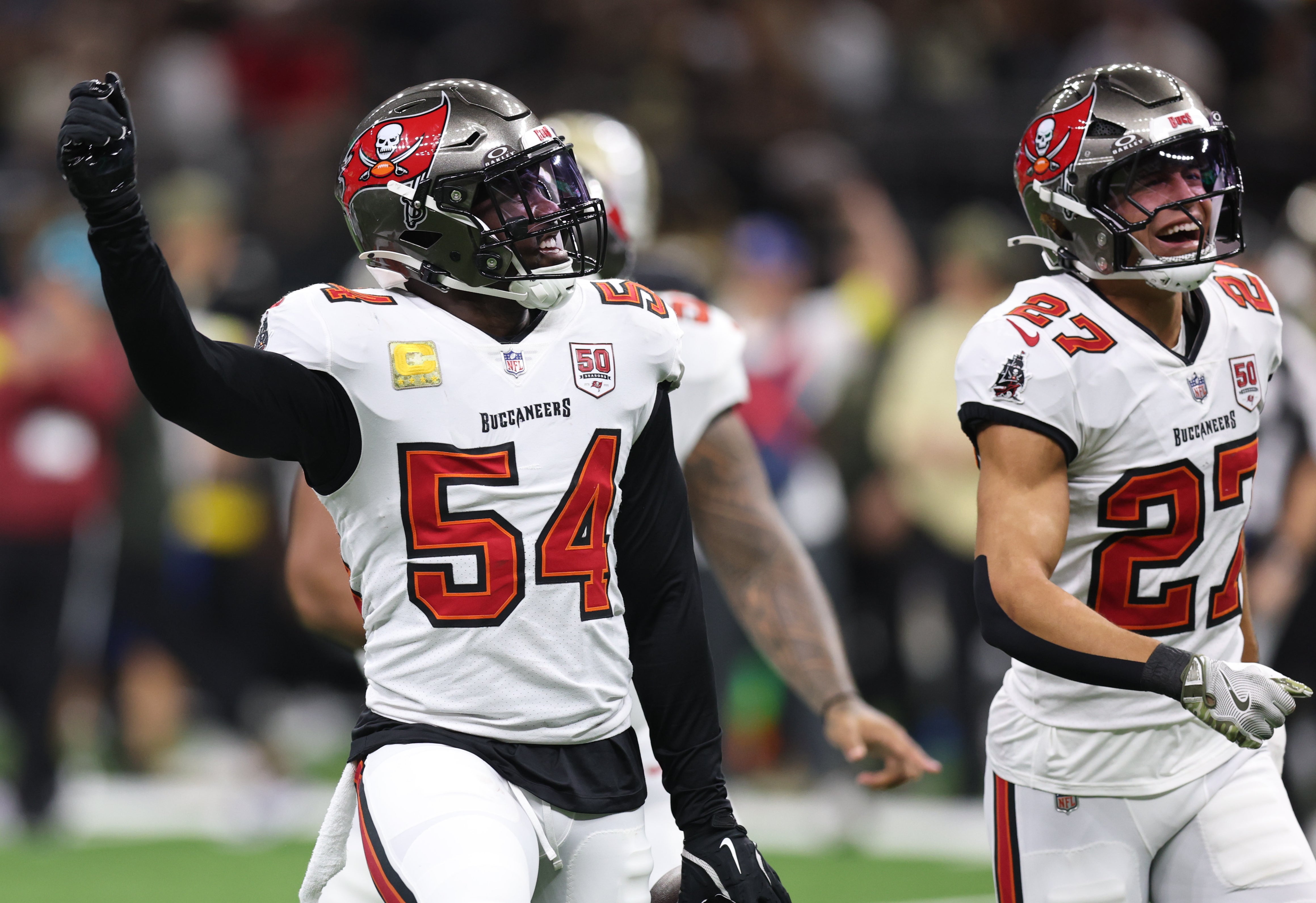 Oct 26, 2025; New Orleans, Louisiana, USA; Tampa Bay Buccaneers outside linebacker Lavonte David (54) and cornerback Zyon McCollum (27) react after a tackle during the first quarter against the New Orleans Saints at Caesars Superdome.