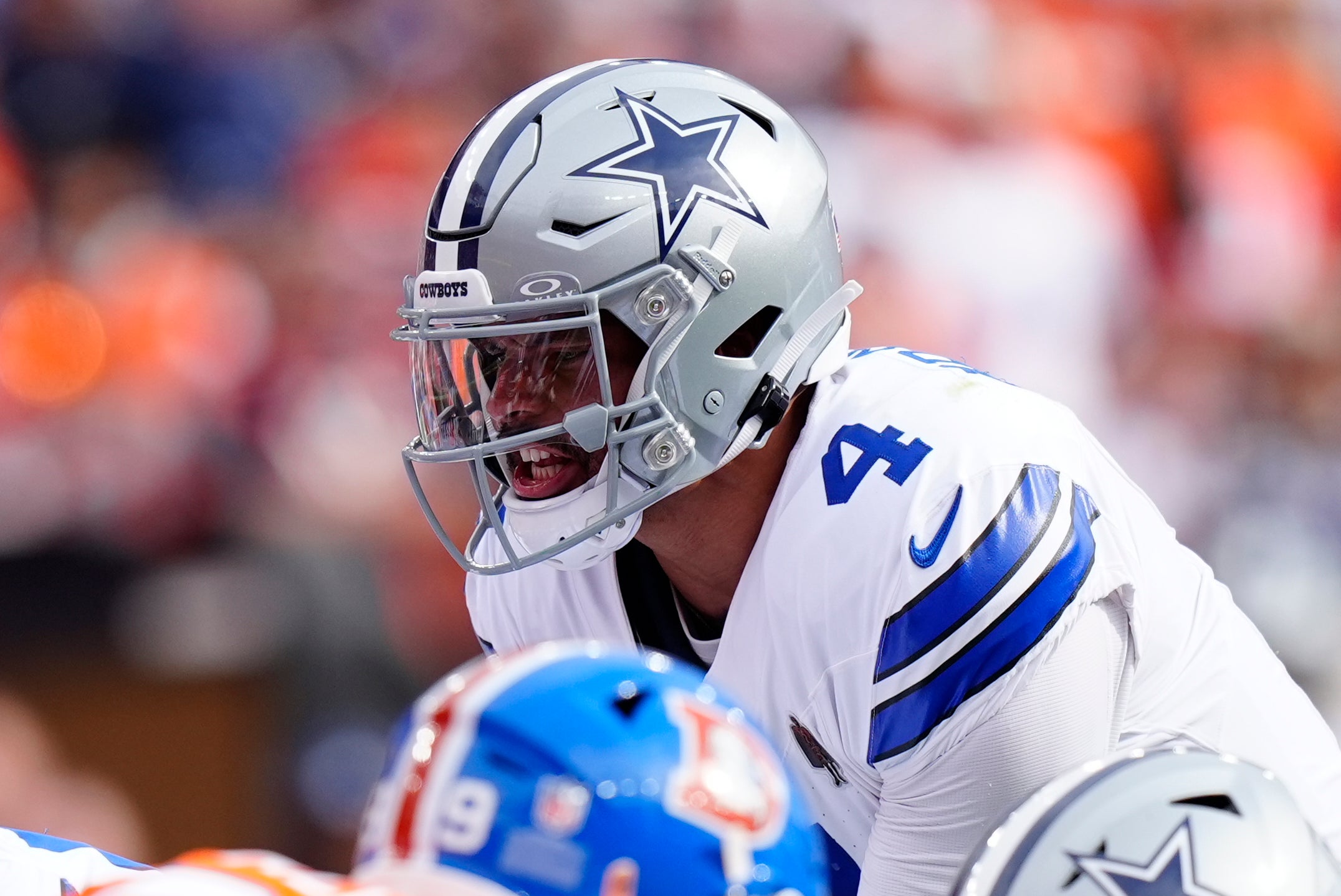 Oct 26, 2025; Denver, Colorado, USA; Dallas Cowboys quarterback Dak Prescott (4) calls a play in the first quarter against the Denver Broncos at Empower Field at Mile High.