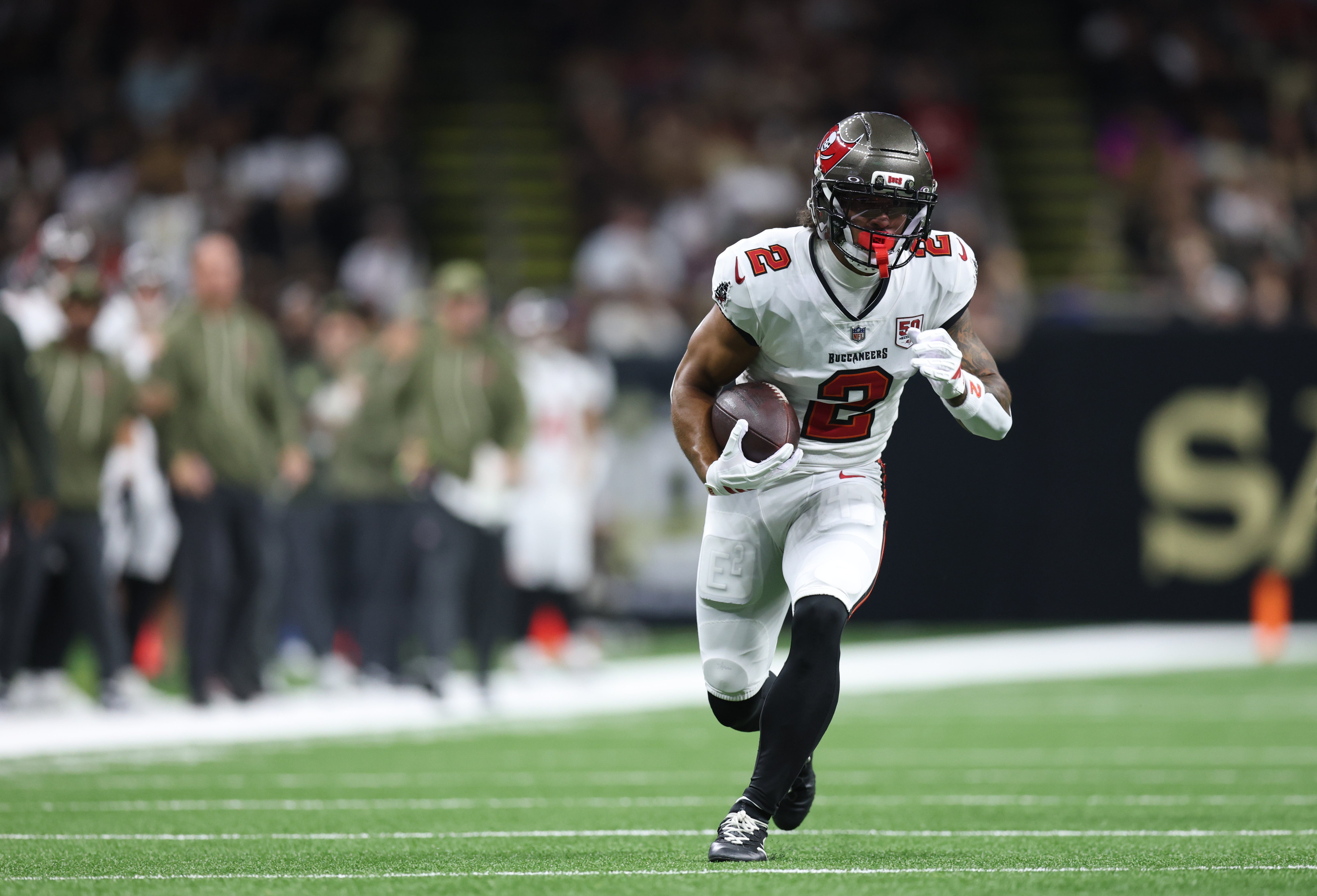 Oct 26, 2025; New Orleans, Louisiana, USA; Tampa Bay Buccaneers wide receiver Emeka Egbuka (2) runs for a gain during the first quarter against the New Orleans Saints at Caesars Superdome.