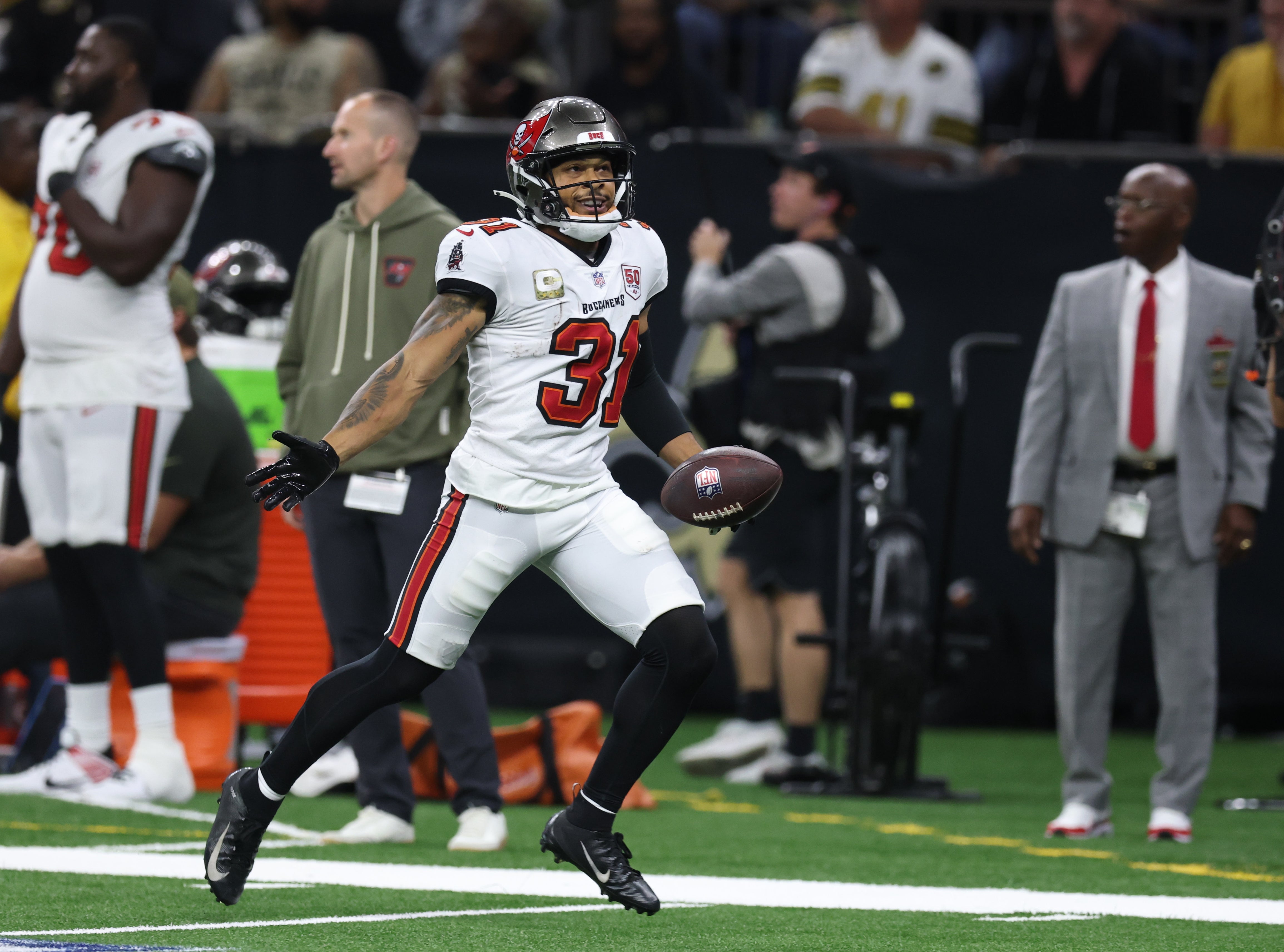 Oct 26, 2025; New Orleans, Louisiana, USA; Tampa Bay Buccaneers safety Antoine Winfield Jr. (31) reacts after running for a gain during the fourth quarter against the New Orleans Saints at Caesars Superdome.
