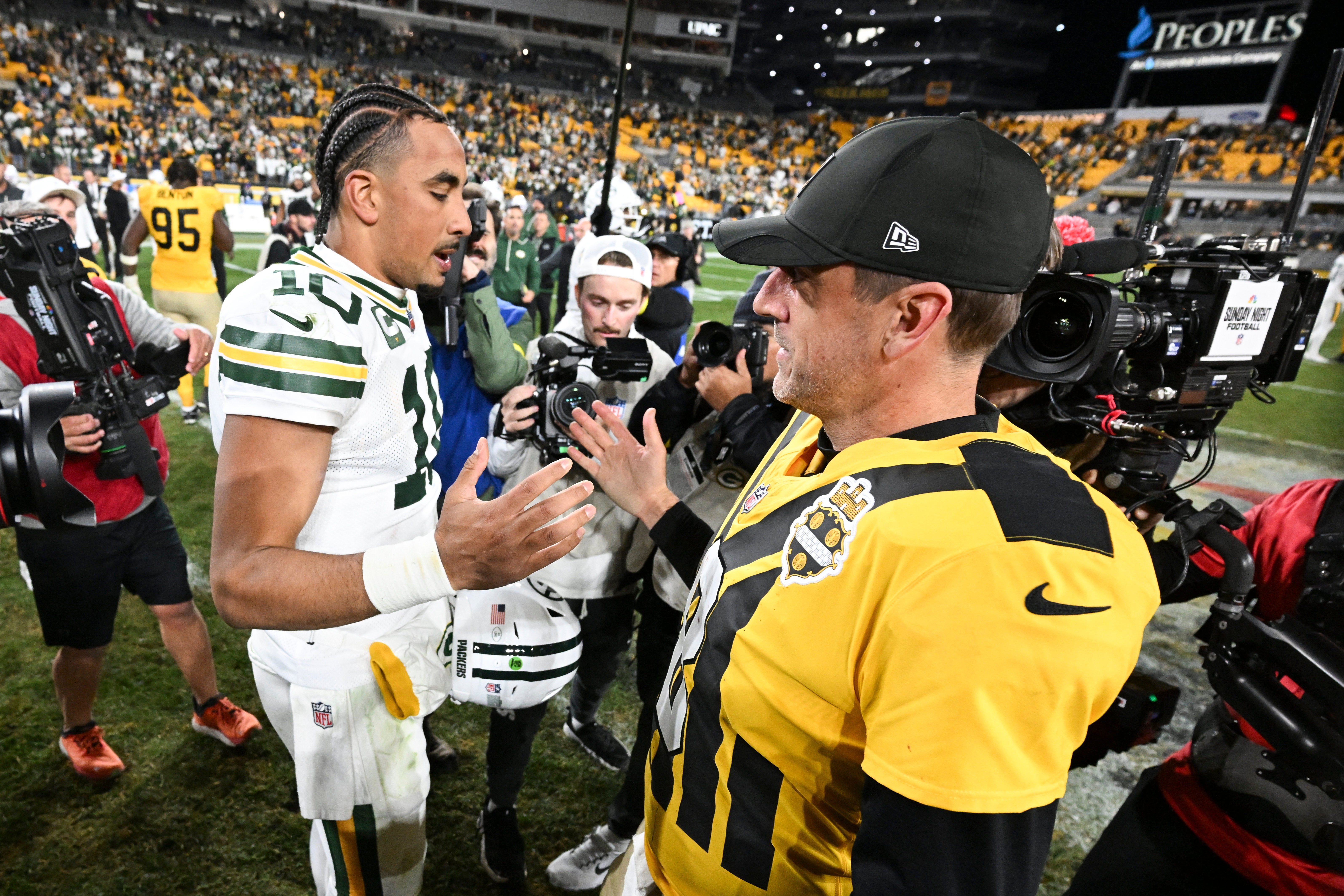 Oct 26, 2025; Pittsburgh, Pennsylvania, USA; Pittsburgh Steelers quarterback Aaron Rodgers (8) and Green Bay Packers quarterback Jordan Love (10) shake hands after the game at Acrisure Stadium.