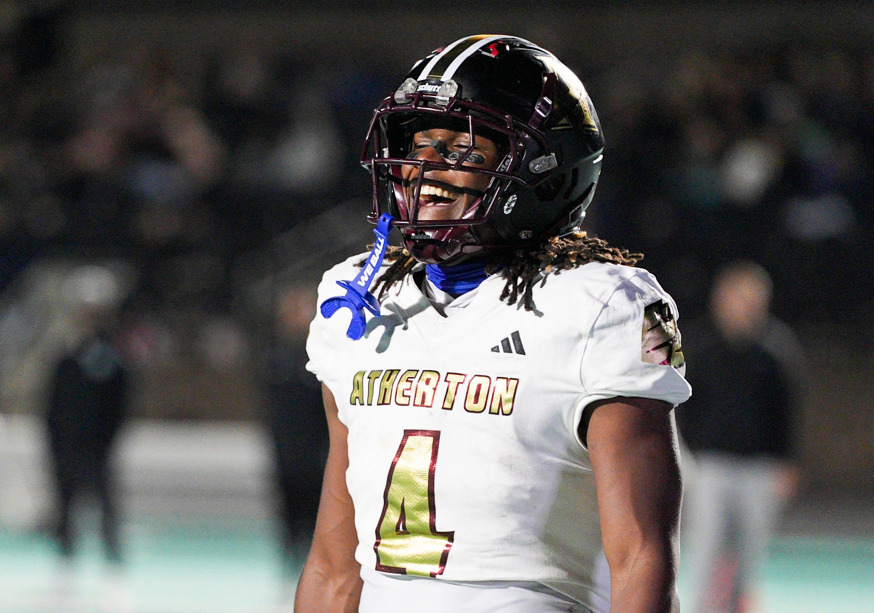Atherton High School's Garyon Hobbs (4) smiled late in the fourth quarter as the Ravens rolled past North Oldham 42-13 KHSAA football on Friday night in Goshen, Kentucky. Oct. 31, 2025