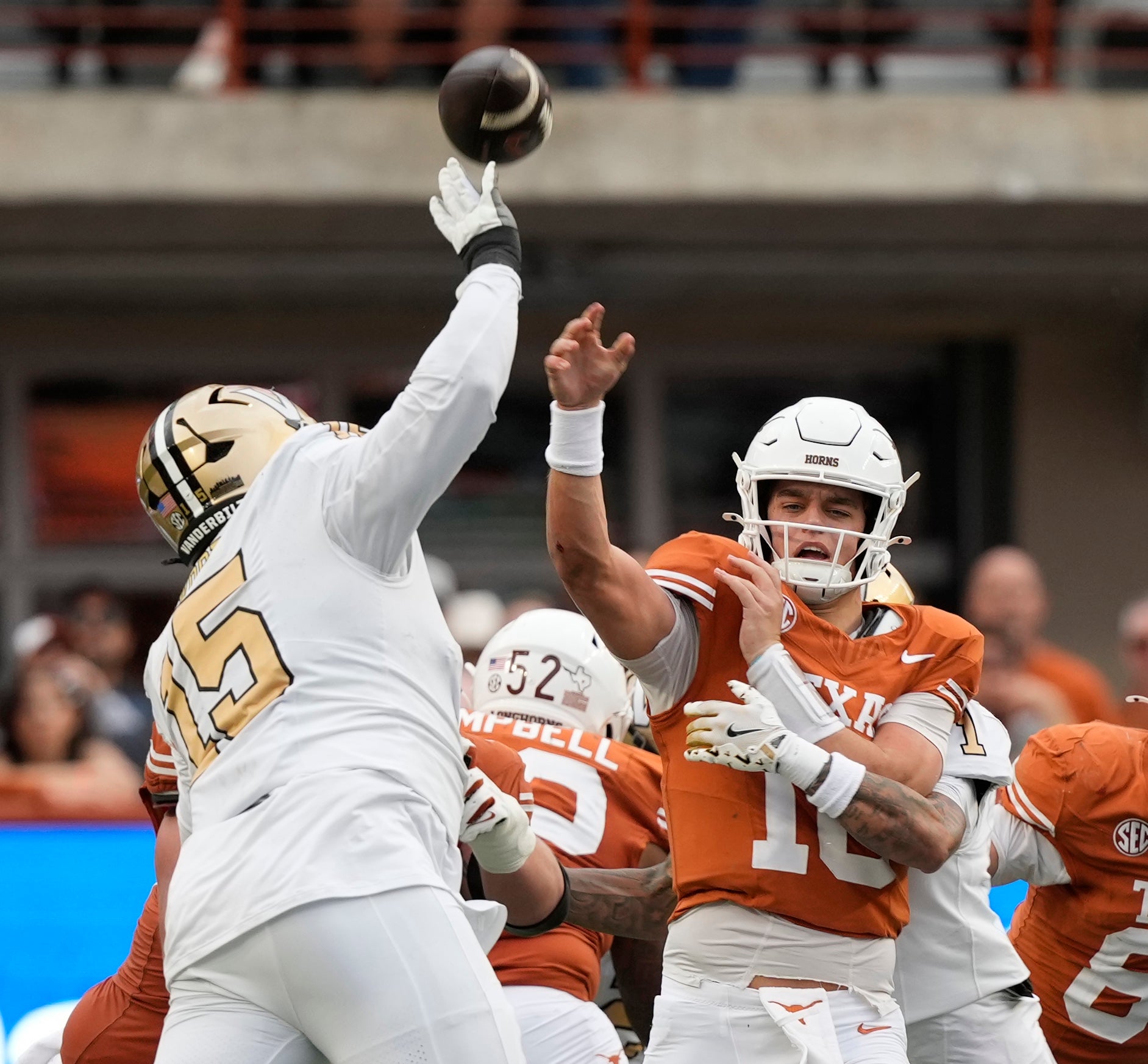 Nov 1, 2025; Austin, Texas, USA; Texas Longhorns quarterback Arch Manning (16) passes over Vanderbilt Commodores defensive lineman Zaylin Wood (15) during the second half at Darrell K Royal-Texas Memorial Stadium. Mandatory Credit: Scott Wachter-Imagn Images