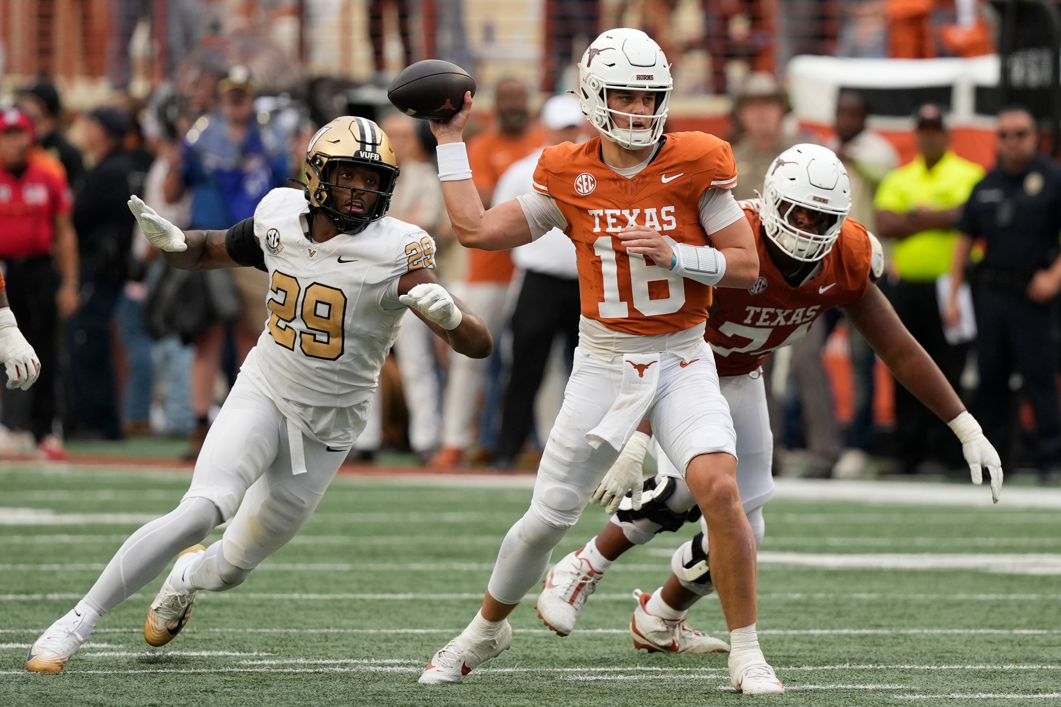 Nov 1, 2025; Austin, Texas, USA; Texas Longhorns quarterback Arch Manning (16) passes ahead of Vanderbilt Commodores defensive back Thomas Jones (9) during the second half at Darrell K Royal-Texas Memorial Stadium. Mandatory Credit: Scott Wachter-Imagn Images