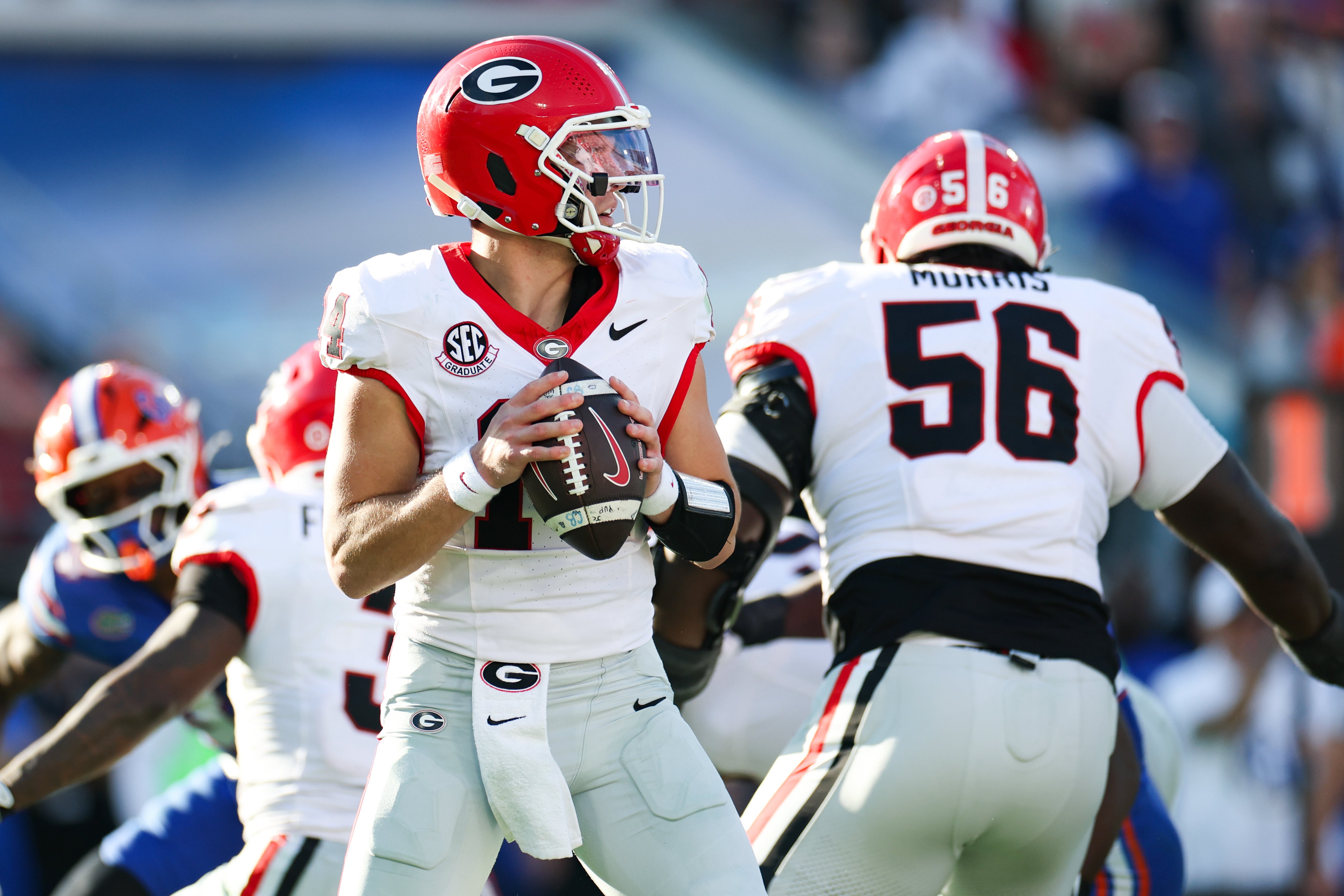 Georgia Bulldogs quarterback Gunner Stockton (14) prepares to throw the ball in the second quarter against the Florida Gators at EverBank Stadium.