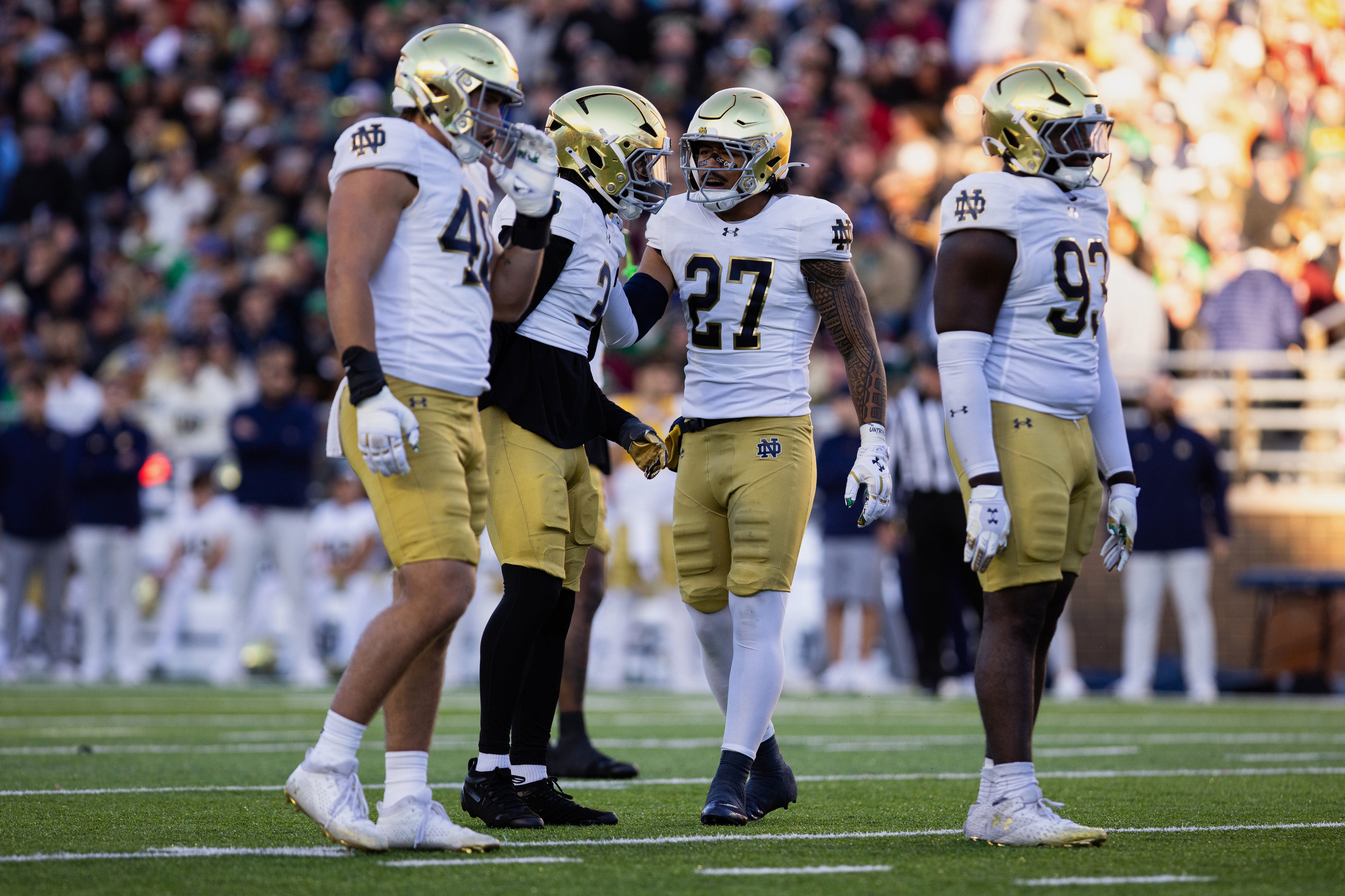 Nov 1, 2025; Chestnut Hill, Massachusetts, USA; Notre Dame Fighting Irish linebacker Kyngstonn Viliamu-Asa (27) talks with linebacker Jaylen Sneed (3) and defensive lineman Joshua Burnham (40) during the second quarter against the Boston College Eagles at Alumni Stadium. Mandatory Credit: Edward Finan-Imagn Images