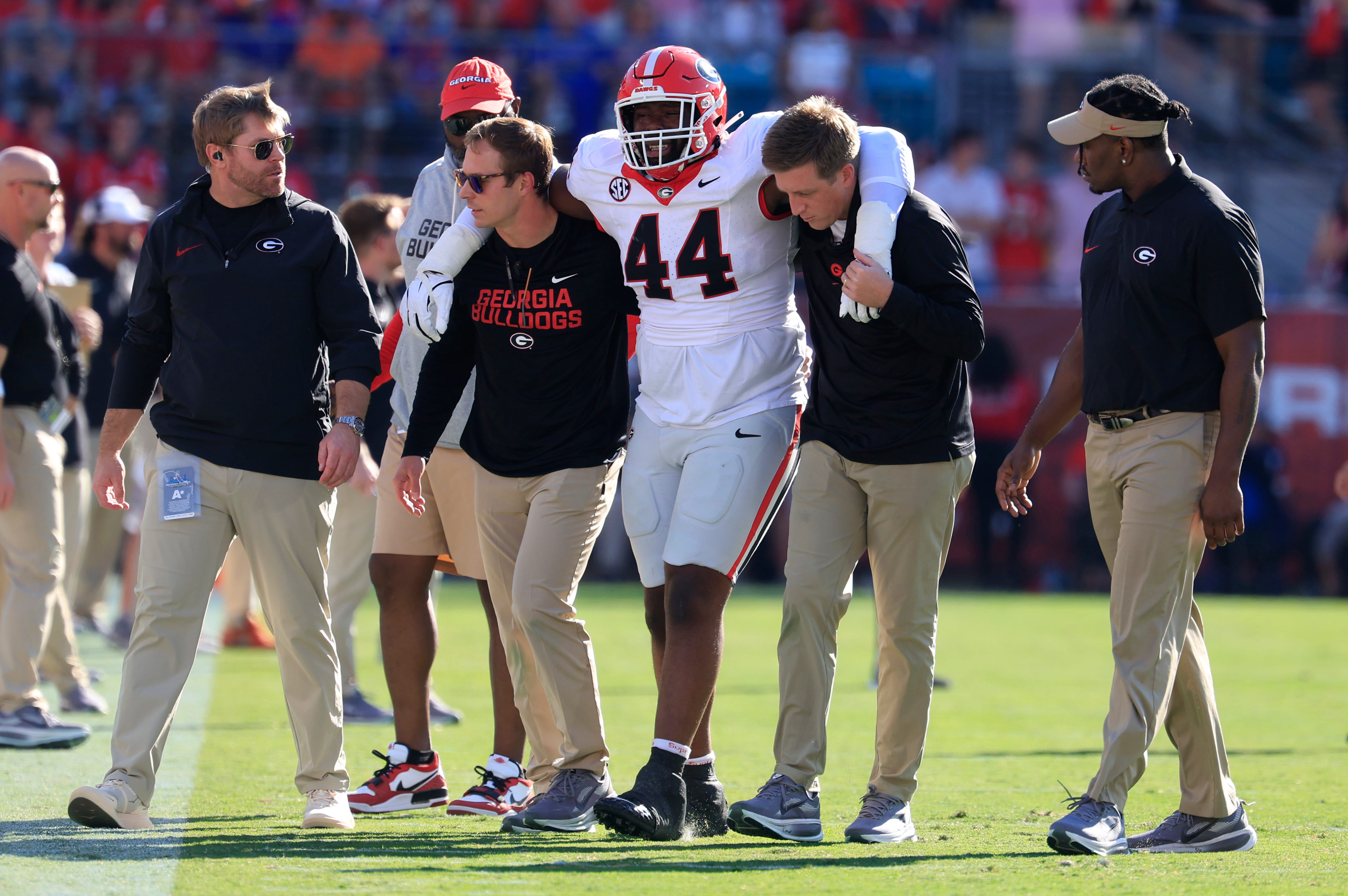defensive lineman Jordan Hall (44) is helped off the field during the first quarter of an NCAA football game, Saturday, Nov. 1, 2025, at EverBank Stadium in Jacksonville, Fla. [Corey Perrine/Florida.