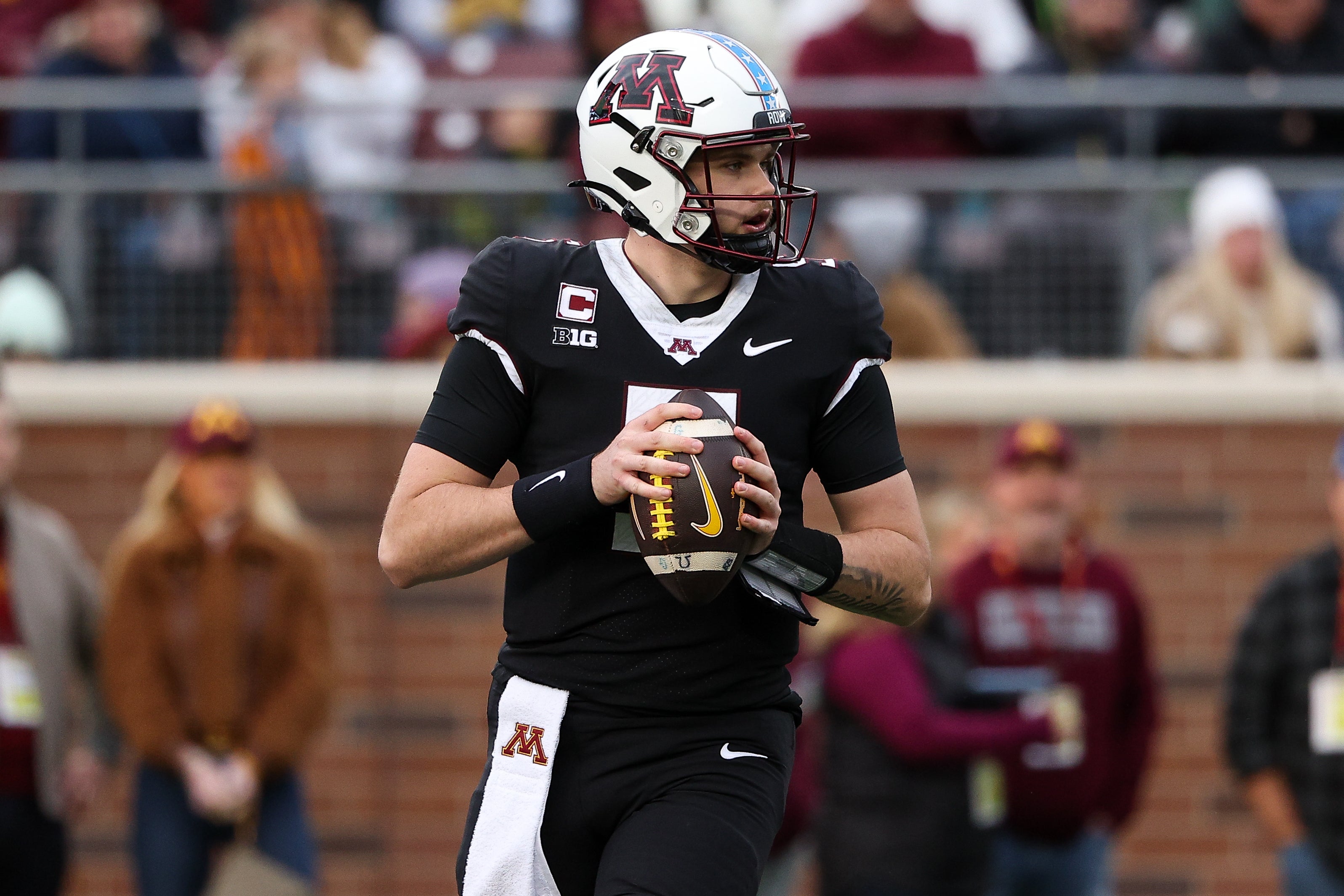 Nov 1, 2025; Minneapolis, Minnesota, USA; Minnesota Golden Gophers quarterback Drake Lindsey (5) looks to throw against the Michigan State Spartans during the second half at Huntington Bank Stadium. Mandatory Credit: Matt Krohn-Imagn Images