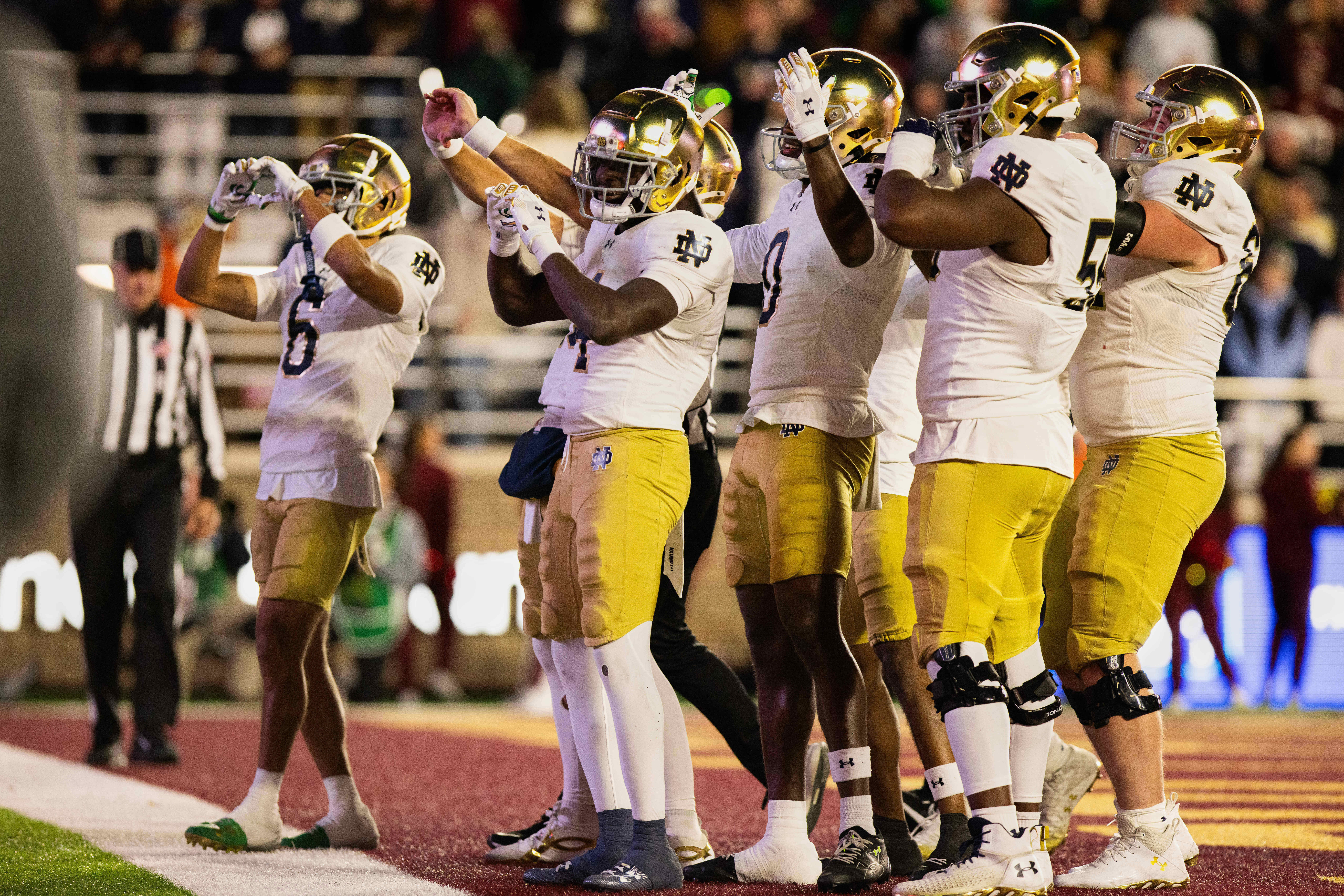 Nov 1, 2025; Chestnut Hill, Massachusetts, USA; Notre Dame Fighting Irish running back Jeremiyah Love (4) celebrates with his teammates after a touchdown in the third quarter against the Boston College Eagles at Alumni Stadium. Mandatory Credit: Edward Finan-Imagn Images