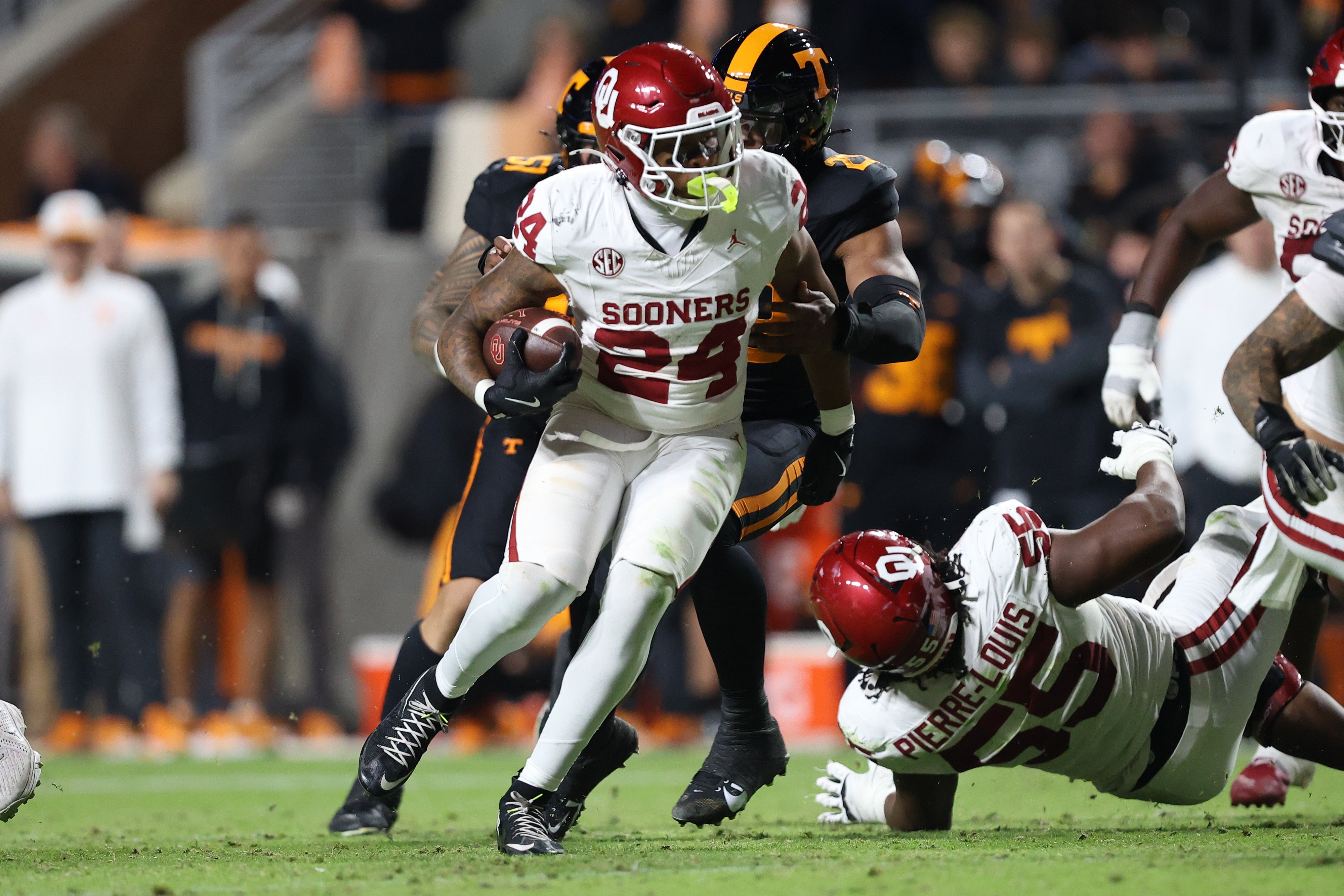 Nov 1, 2025; Knoxville, Tennessee, USA; Oklahoma Sooners running back Xavier Robinson (24) runs the ball against the Tennessee Volunteers during the second quarter at Neyland Stadium.