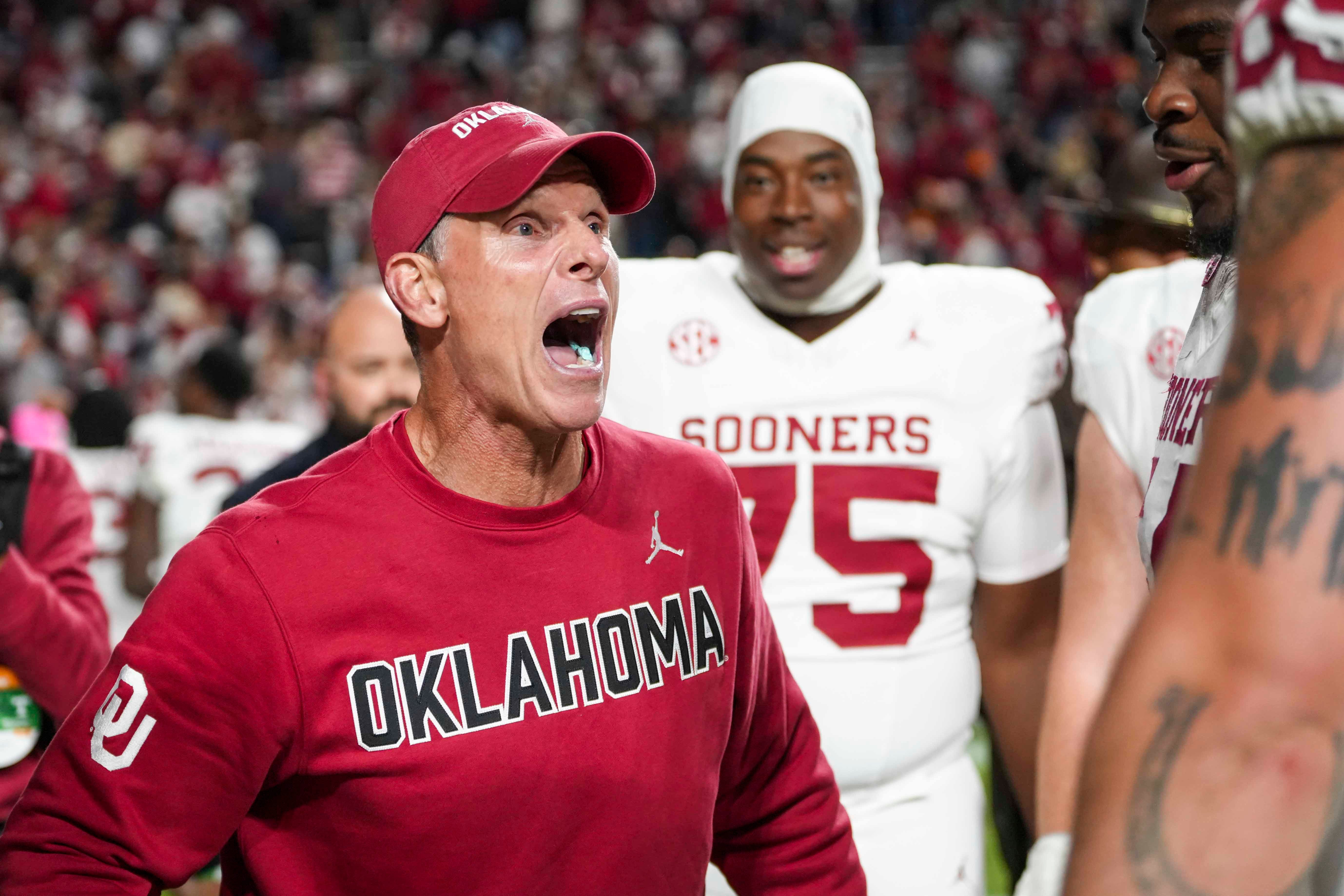 Oklahoma coach Brent Venables celebrates with his players after winning a NCAA football game between the Tennessee Volunteers and Oklahoma Sooners at Neyland Stadium in Knoxville, Tenn., on November 1, 2025.