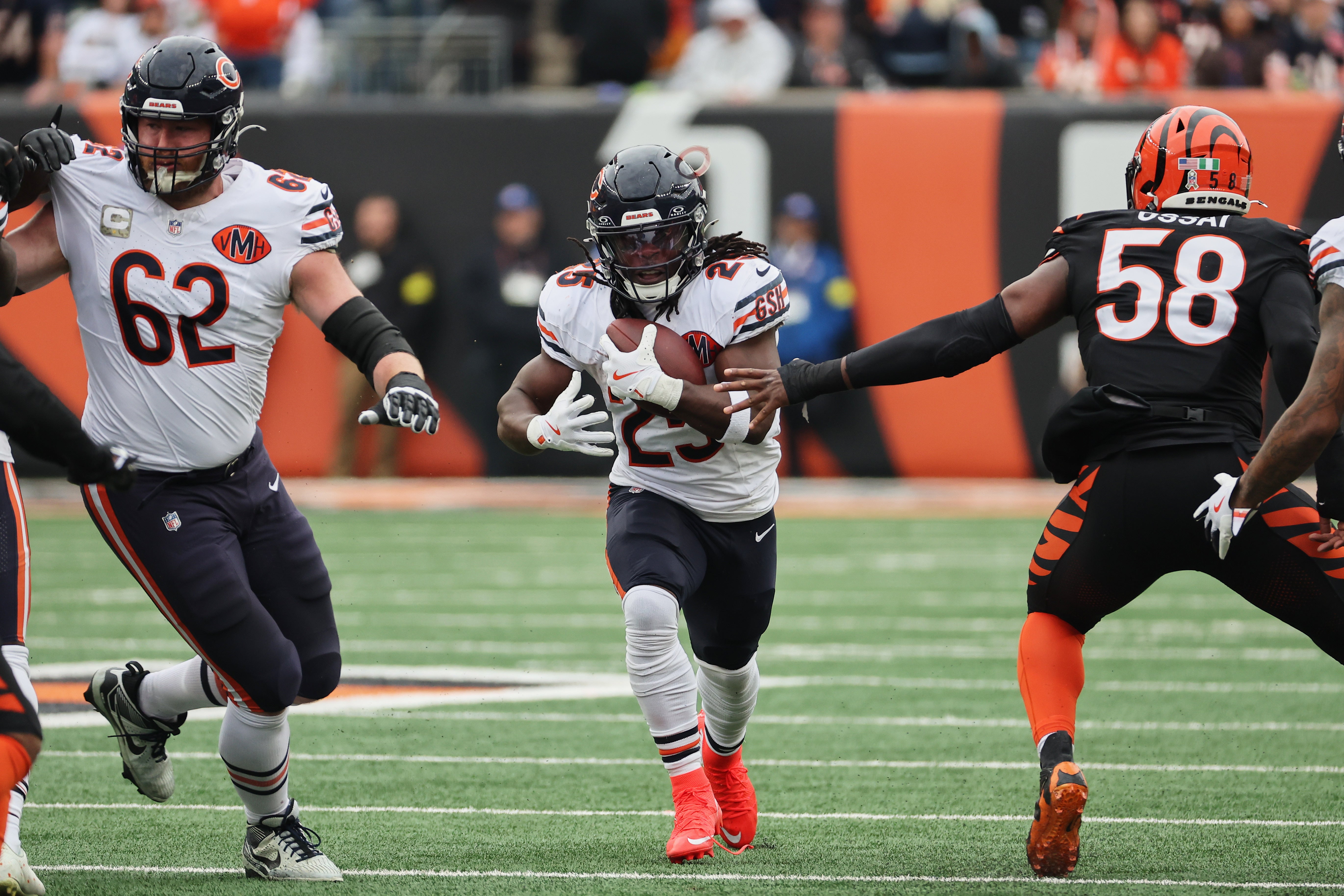 Nov 2, 2025; Cincinnati, Ohio, USA; Chicago Bears running back Kyle Monangai (25) runs the ball and guard Joe Thuney (62) blocks against Cincinnati Bengals defensive end Joseph Ossai (58) during the first quarter at Paycor Stadium.
