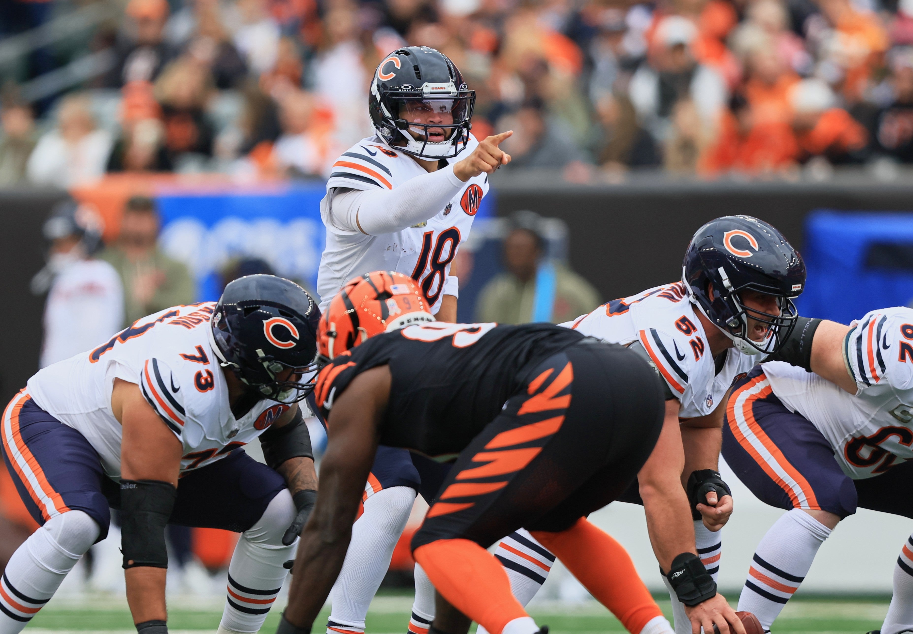 Nov 2, 2025; Cincinnati, Ohio, USA; Chicago Bears quarterback Caleb Williams (18) gestures toward the Cincinnati Bengals defense at the line of scrimmage during the first quarter at Paycor Stadium.