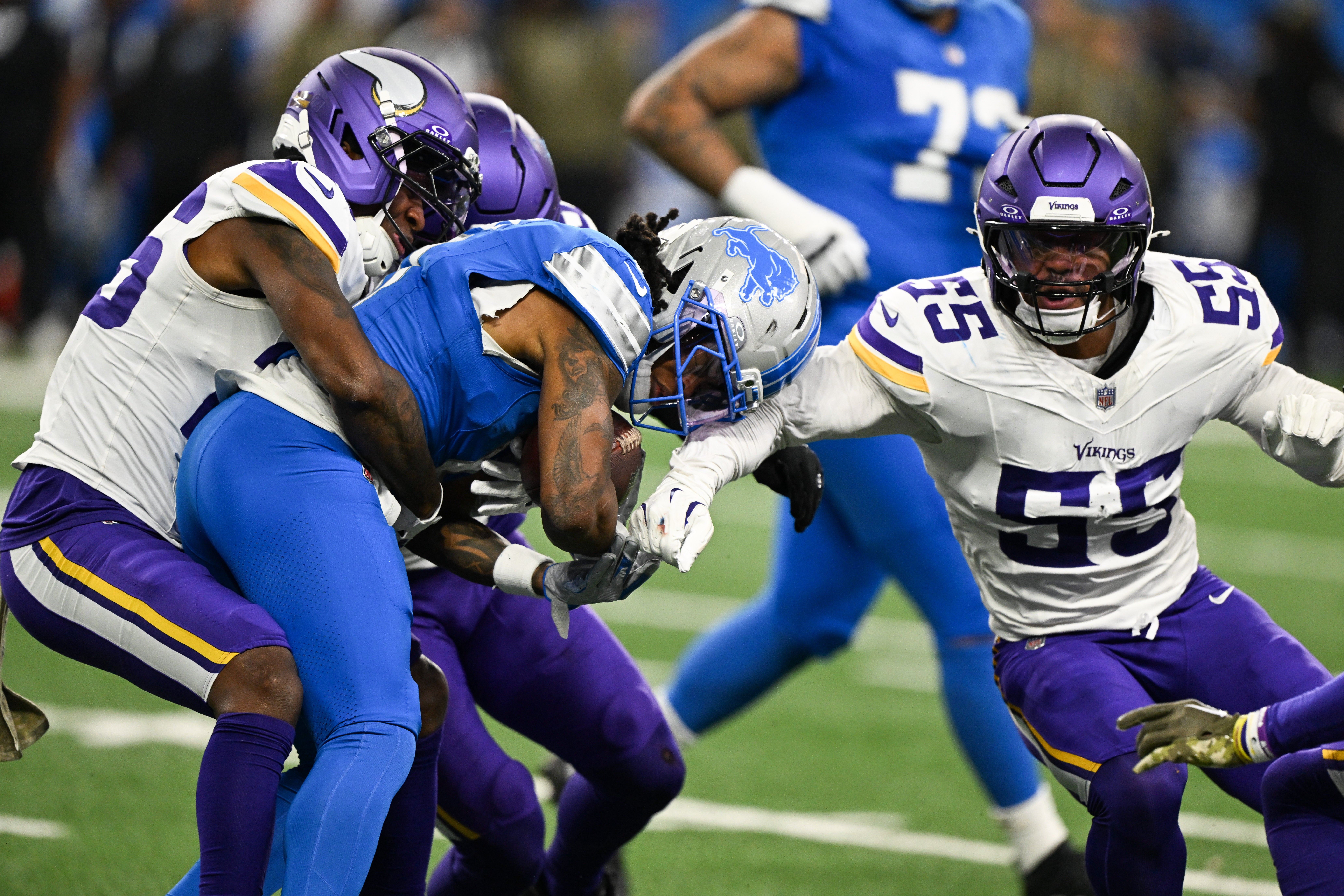 Nov 2, 2025; Detroit, Michigan, USA; Detroit Lions running back Jahmyr Gibbs (0) runs the ball against Minnesota Vikings safety Theo Jackson (26) and linebacker Eric Wilson (55) in the first quarter at Ford Field.