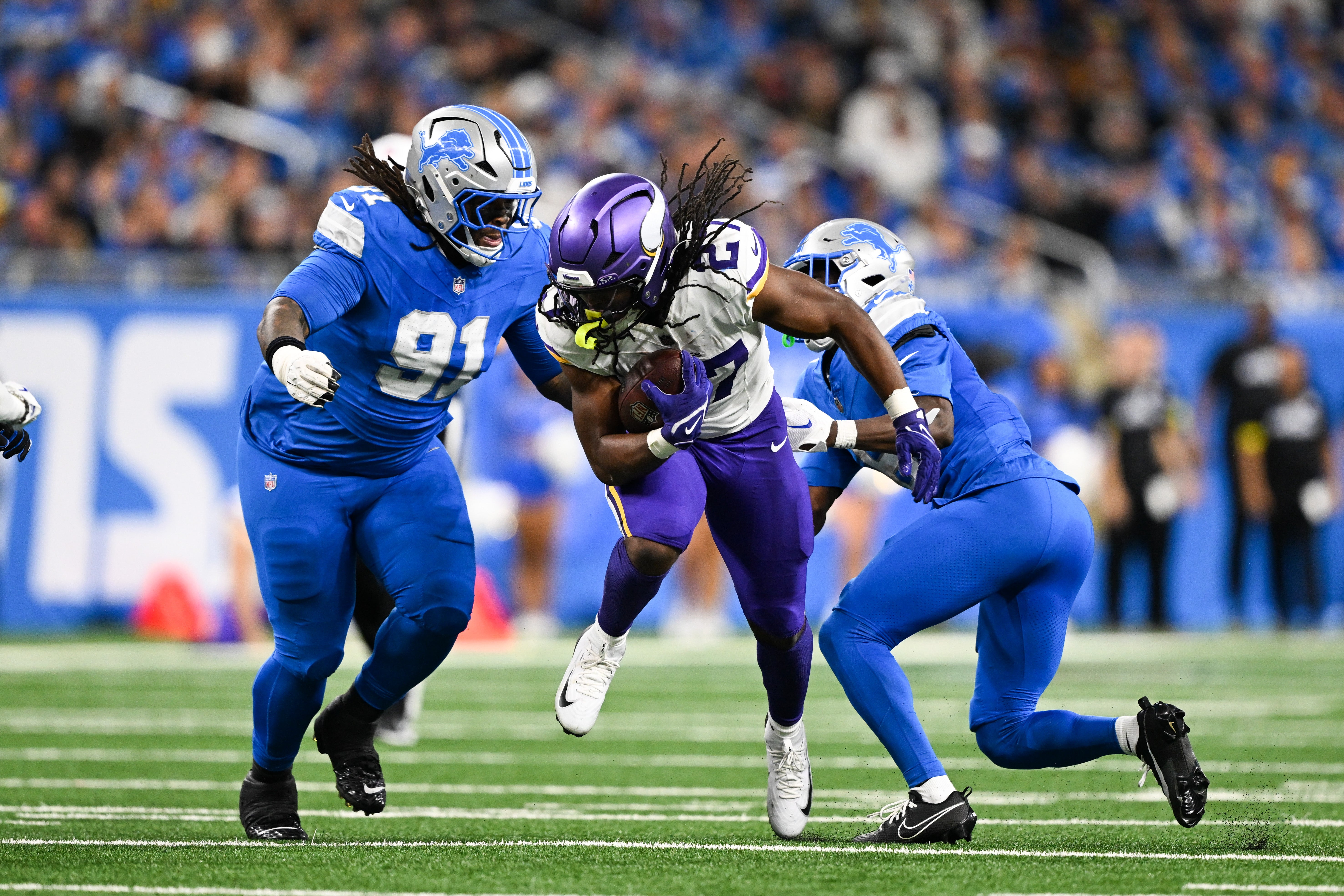 Nov 2, 2025; Detroit, Michigan, USA; Minnesota Vikings running back Jordan Mason (27) runs the ball in the third quarter against the Detroit Lions at Ford Field.