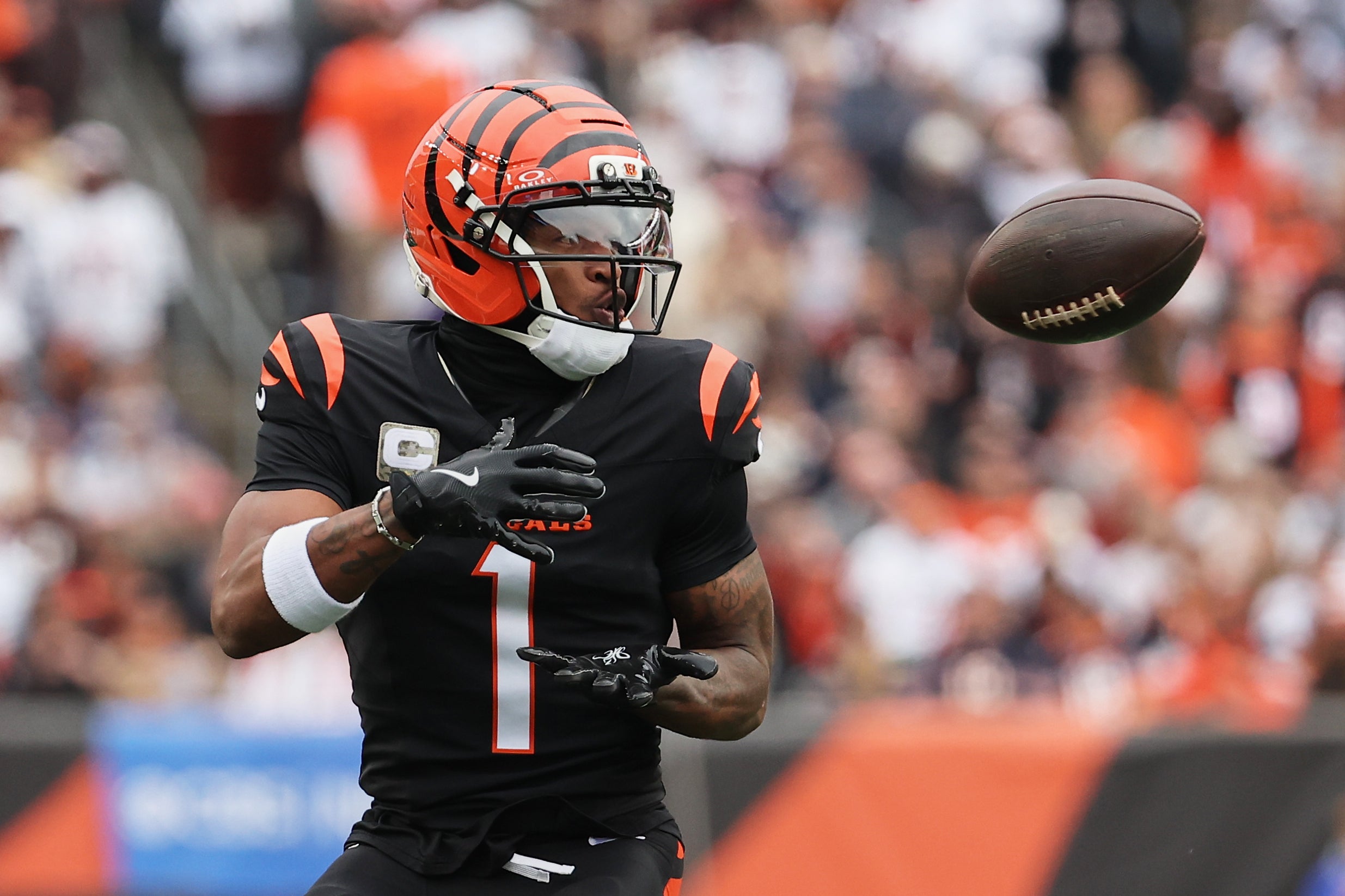Nov 2, 2025; Cincinnati, Ohio, USA; Cincinnati Bengals wide receiver Ja'Marr Chase (1) catches a pass against the Chicago Bears during the second quarter at Paycor Stadium.