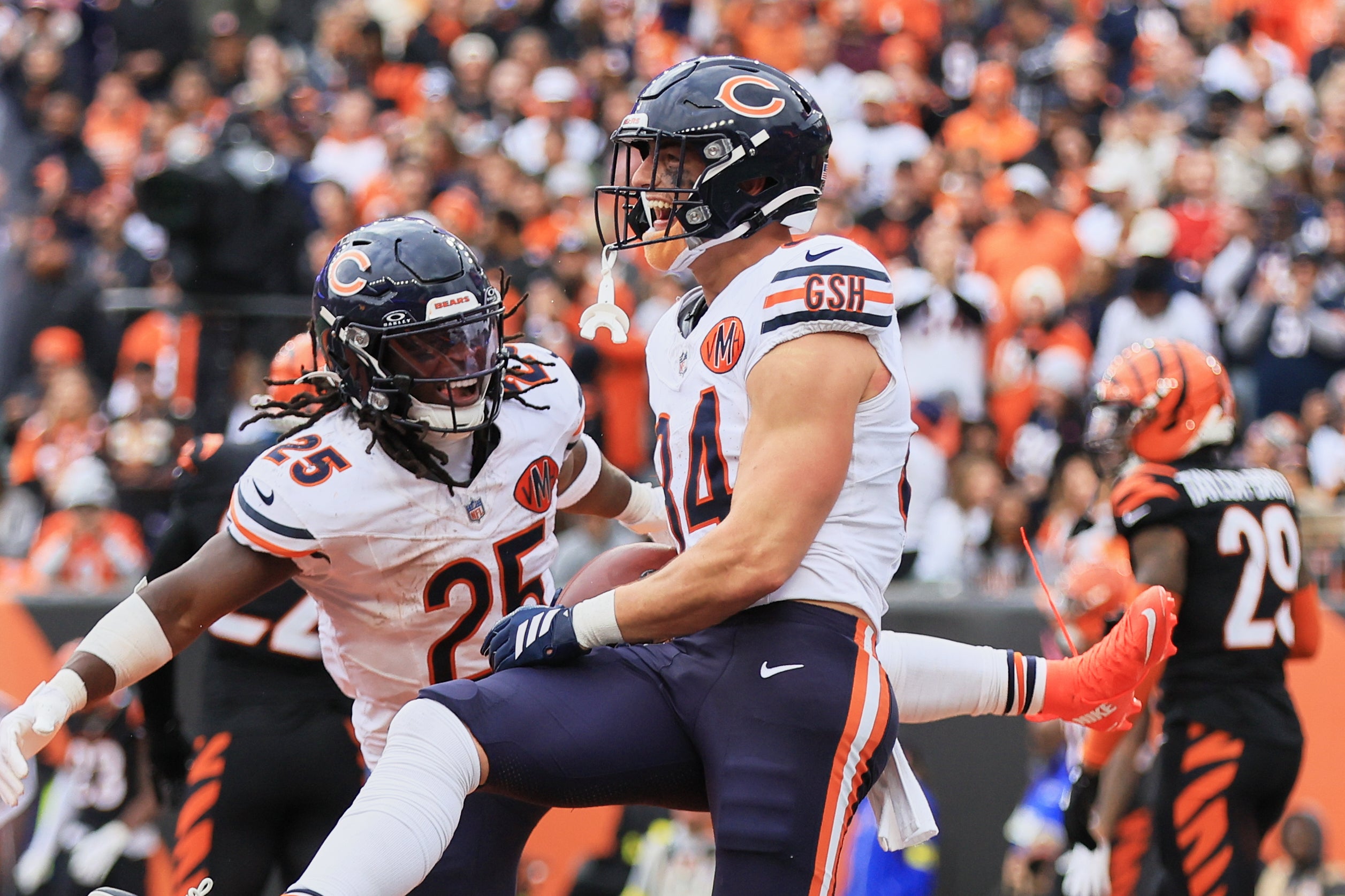 Nov 2, 2025; Cincinnati, Ohio, USA; Chicago Bears tight end Colston Loveland (84) celebrates with wide receiver Olamide Zaccheaus (14) after catching a 5-yard touchdown pass against the Cincinnati Bengals during the third quarter at Paycor Stadium.