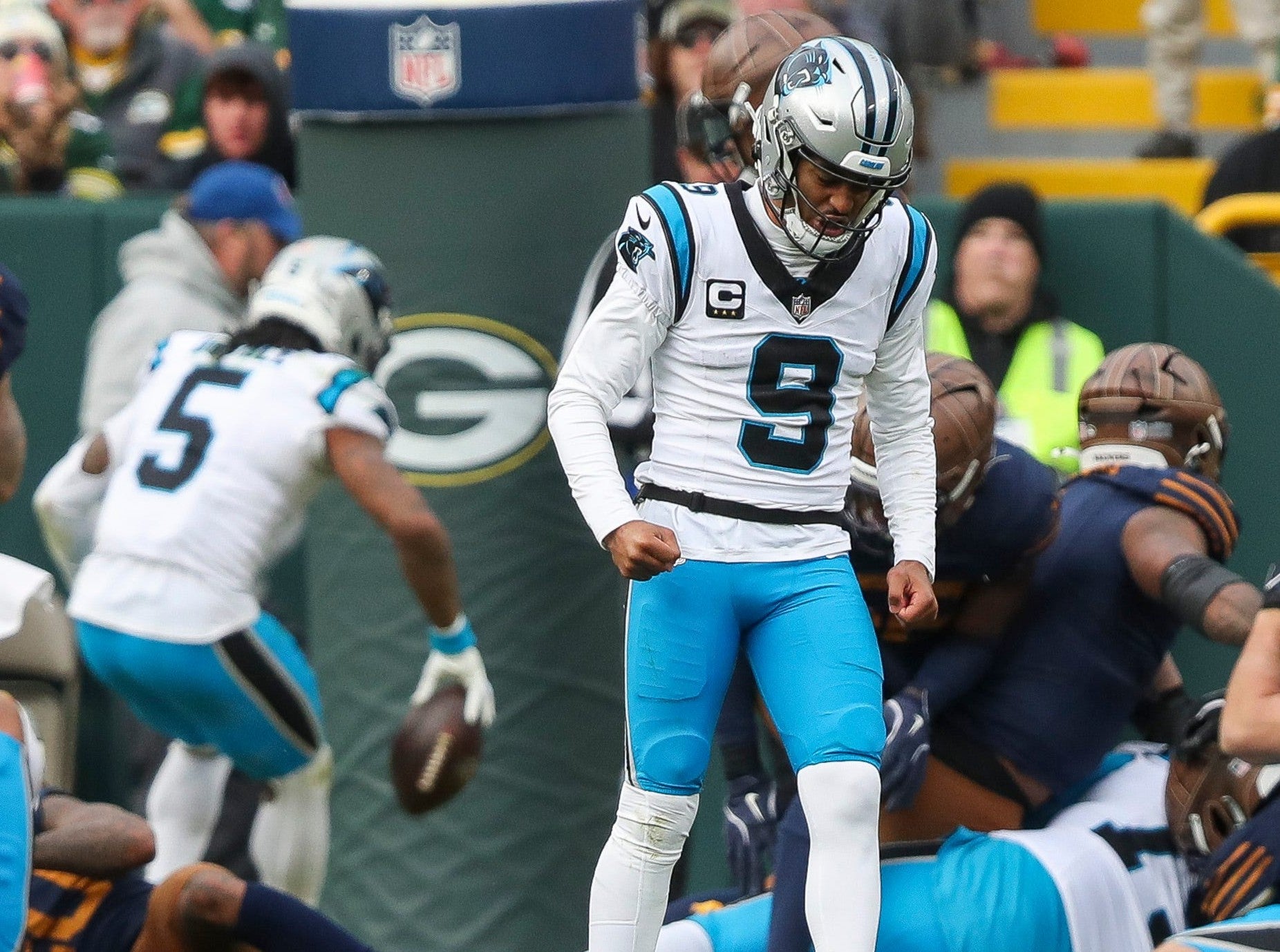 Carolina Panthers quarterback Bryce Young (9) reacts as running back Rico Dowdle (5) scores a touchdown against the Green Bay Packers on Sunday, November 2, 2025, at Lambeau Field in Green Bay, Wis.