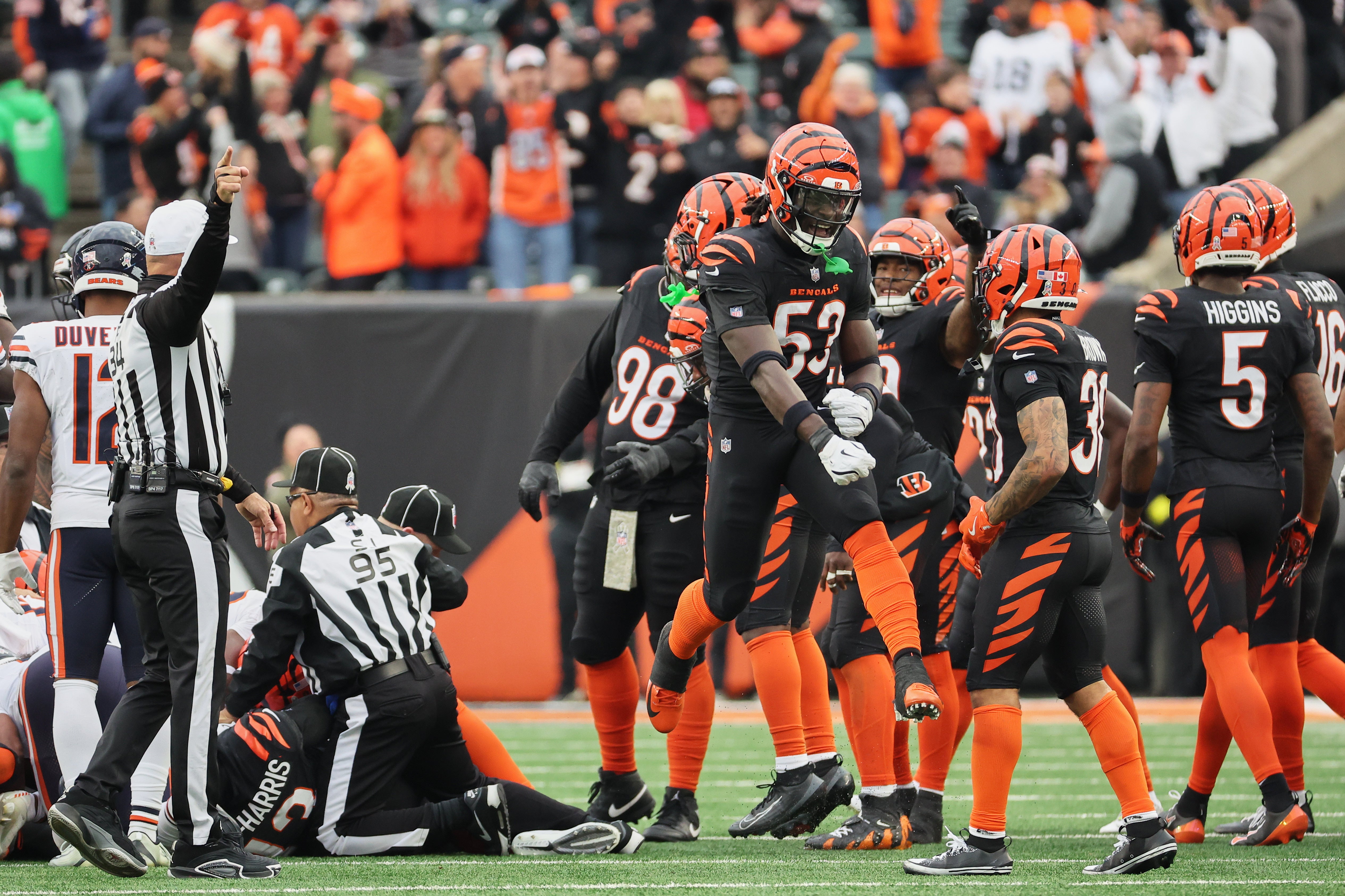 Nov 2, 2025; Cincinnati, Ohio, USA; Cincinnati Bengals linebacker Brian Asamoah II (53) leaps and celebrates after Cincinnati recovered an onside kick against the Chicago Bears during the fourth quarter at Paycor Stadium.