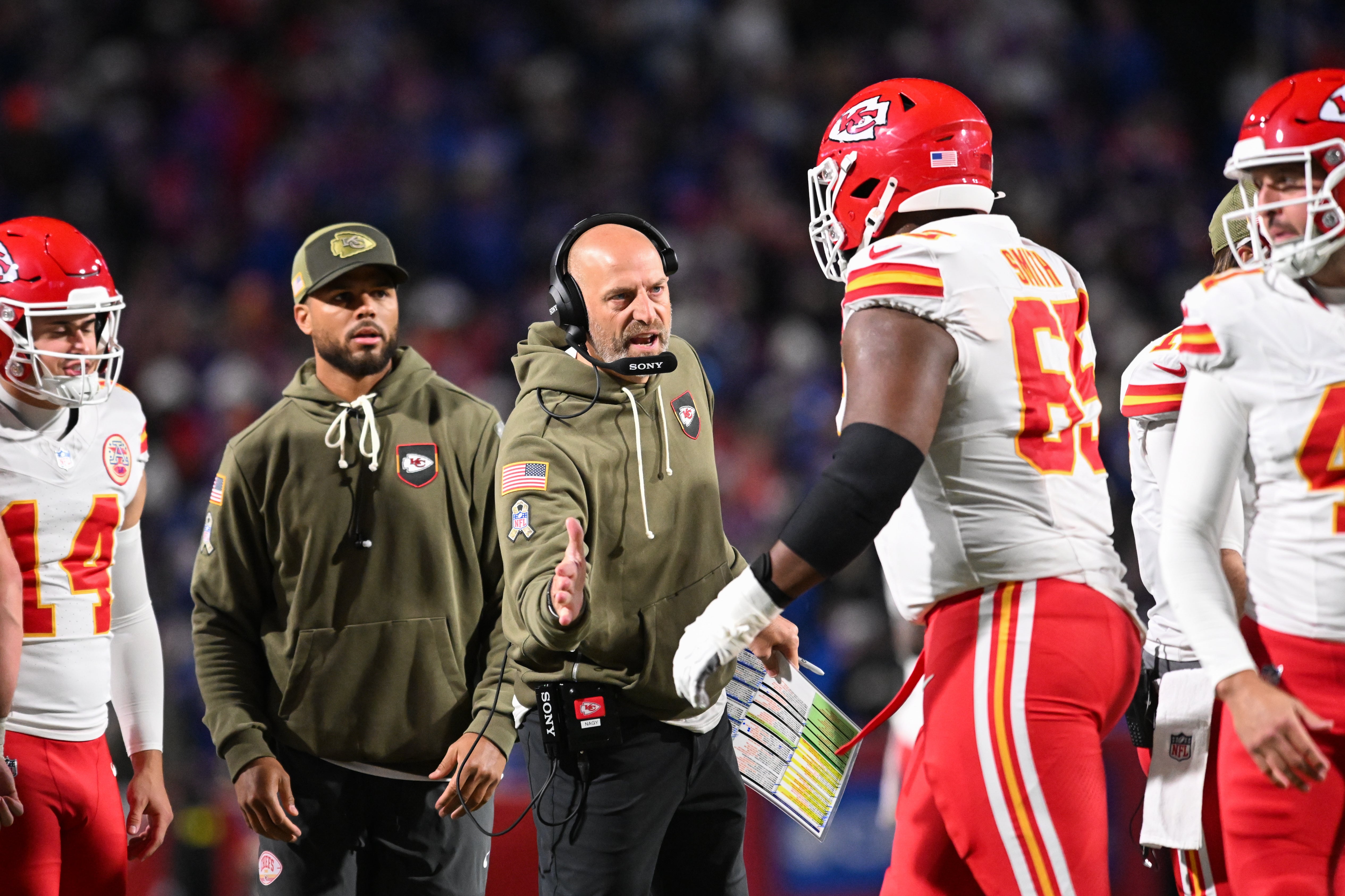Kansas City Chiefs offensive coordinator Matt Nagy greets guard Trey Smith (65) in the second half against the Buffalo Bills